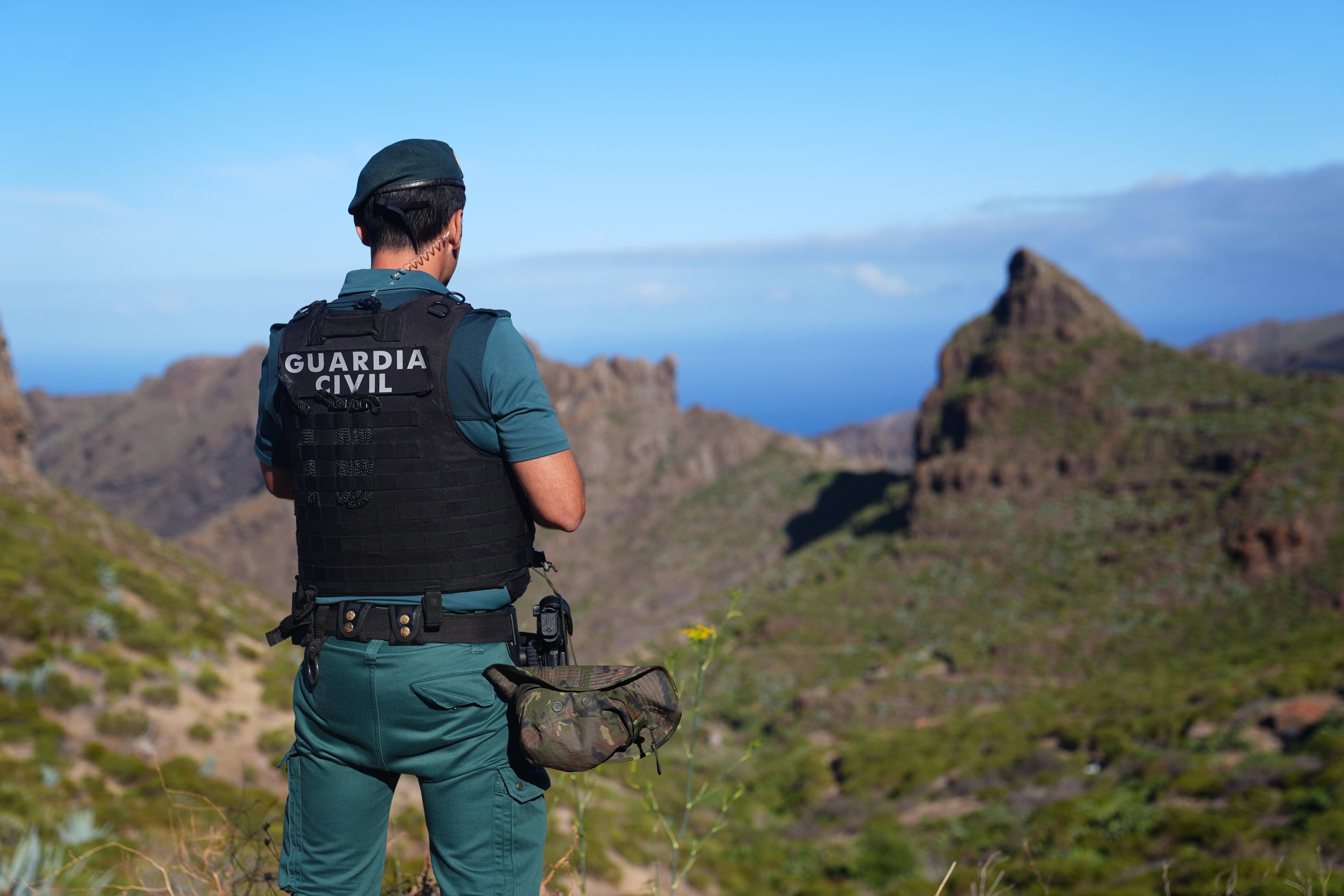 A Spanish police officer looks over the village of Masca, Tenerife, during the search for Mr Slater