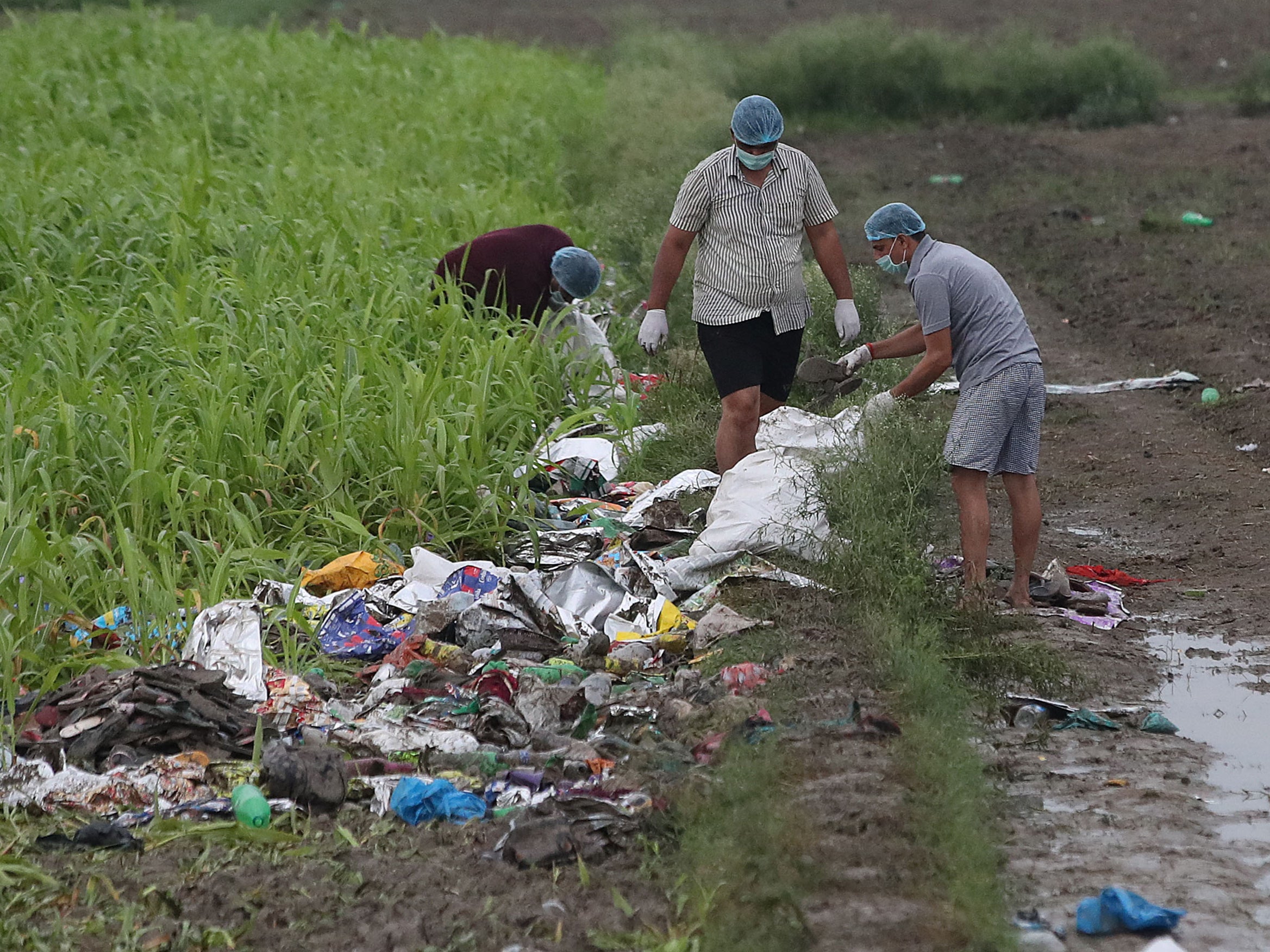 Forensic experts gather evidence from the site of the stampede in Hathras, Uttar Pradesh, on 3 July 2024
