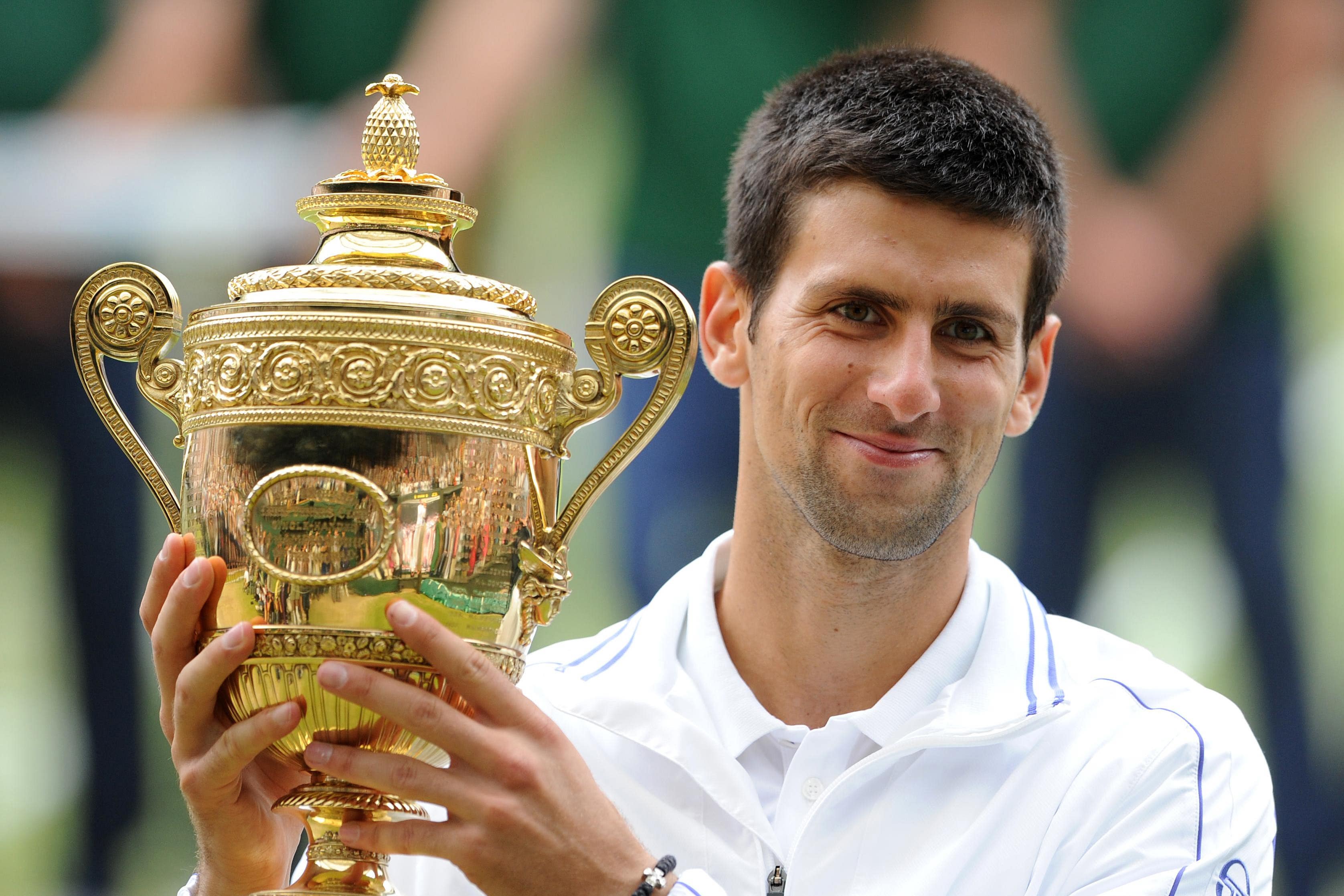 Serbia’s Novak Djokovic celebrates becoming Wimbledon’s men’s champion for the first time (Anthony Devlin/PA)