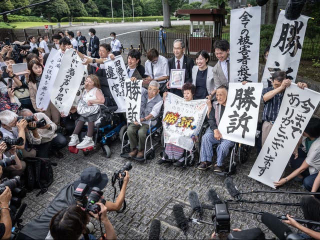 <p>Some victims of the forced sterilisation programme outside the supreme court in Tokyo on 3 July 2024 </p>