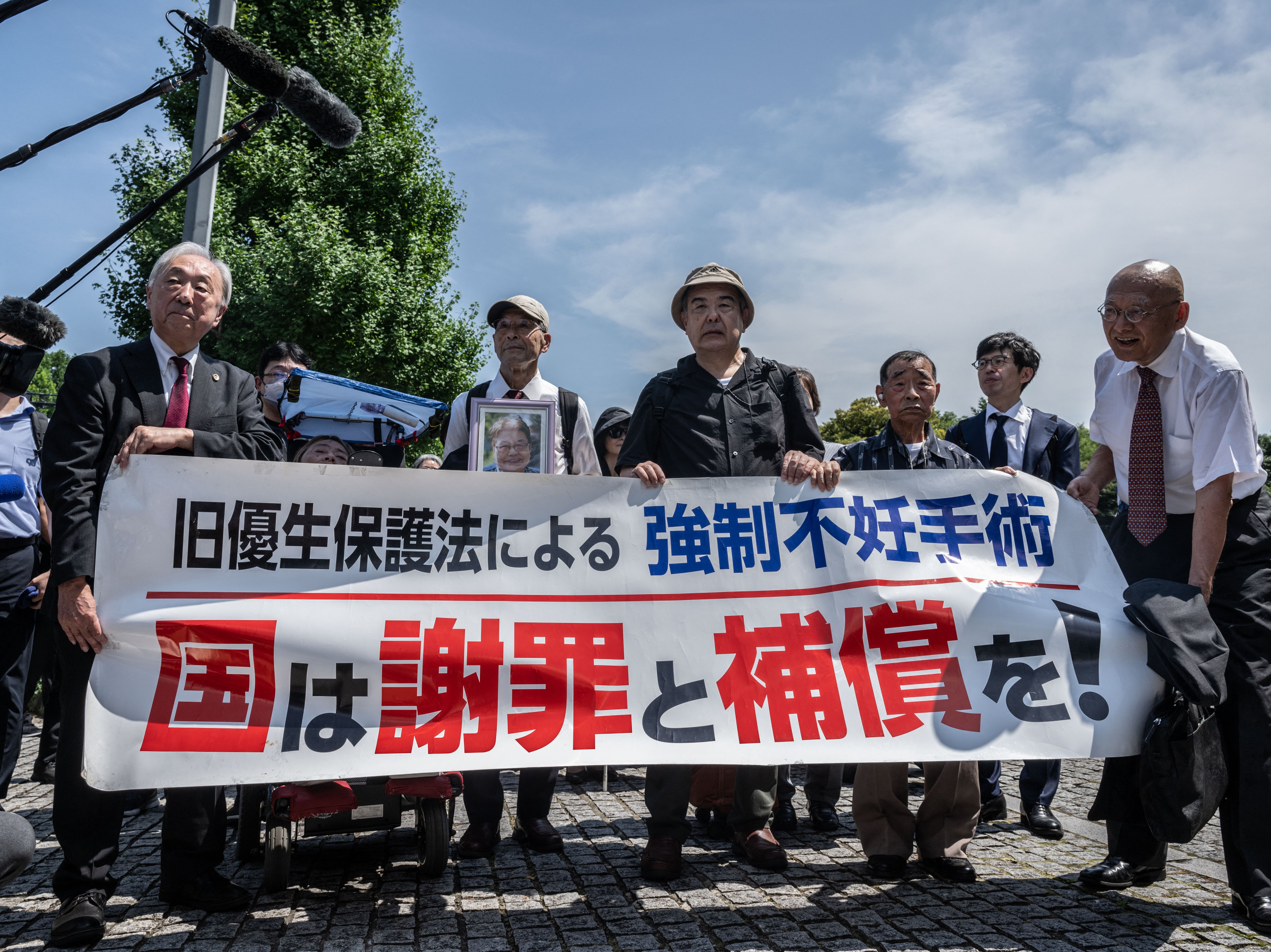 Supporters and lawyers of victims of forced sterilisation march toward Japan’s supreme court in Tokyo on 3 July 2024