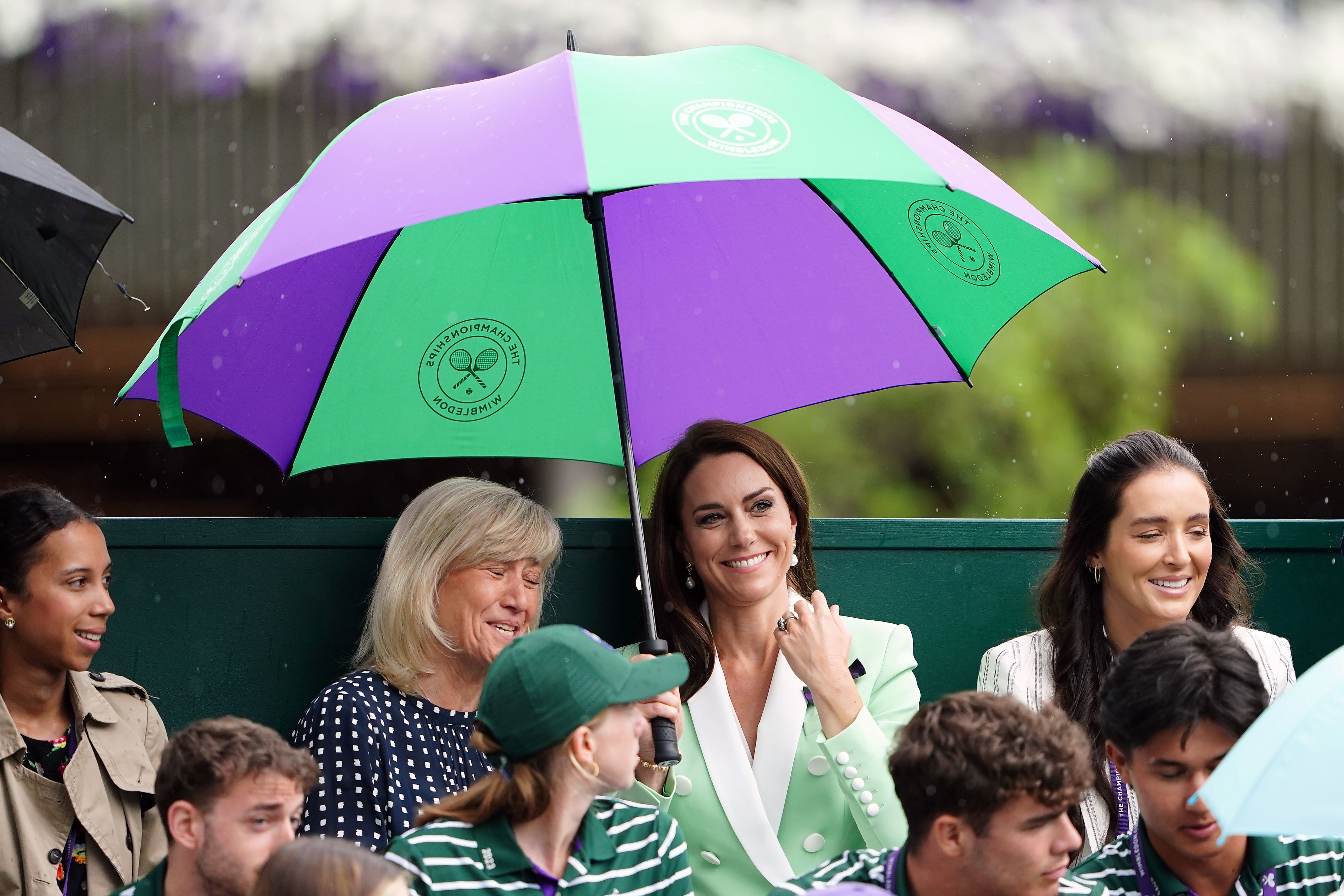 A large umbrella is an essential for every attendee – even the Princess of Wales (Zac Goodwin/PA)