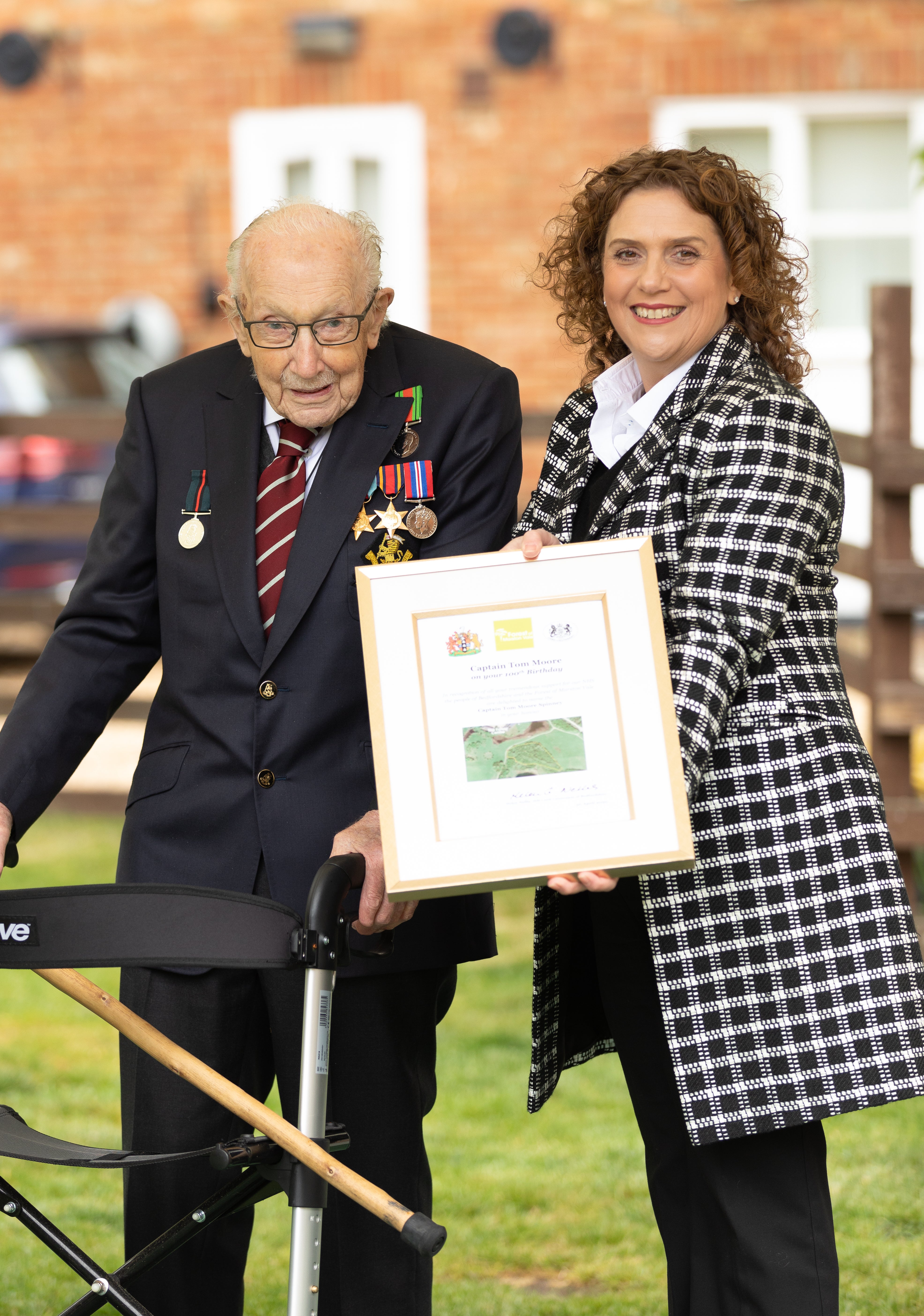 Sir Captain Tom Moore with his daughter Hannah as he celebrated his 100th birthday (Emma Sohl/Capture the Light Photography/PA)