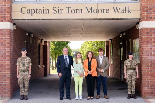 <p>Colin Ingram-Moore (left) and Hannah Ingram-Moore (second from right) have been disqualified as charity trustees </p>