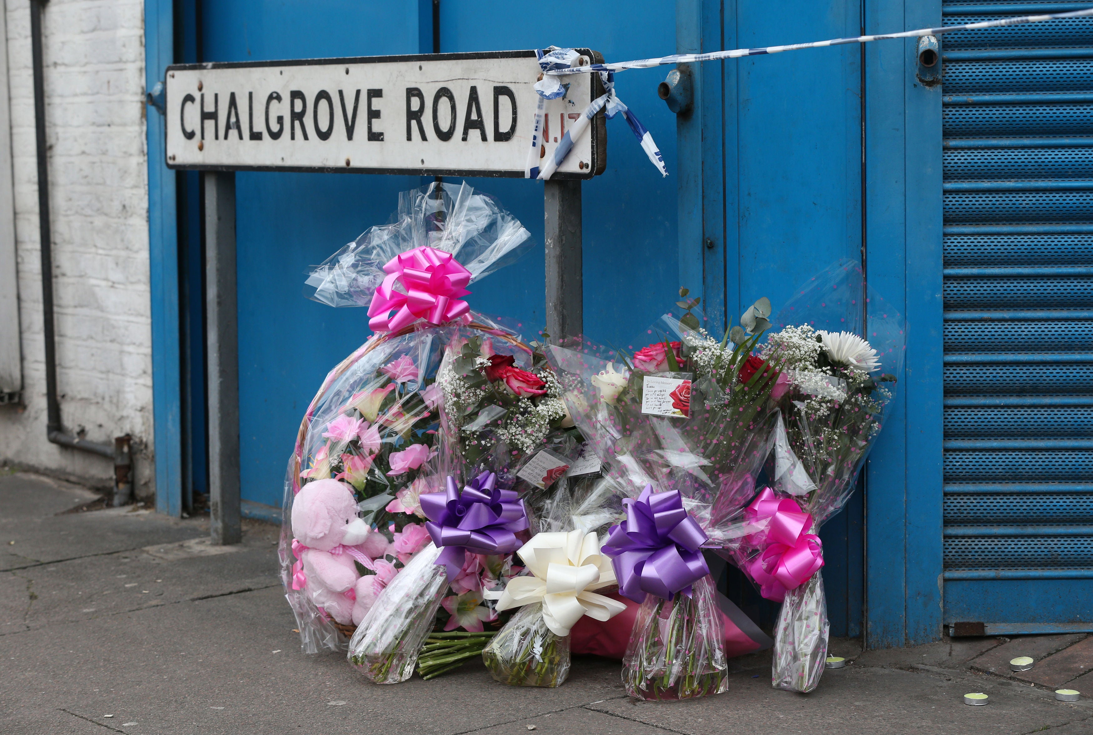 Floral tributes left on Chalgrove Road, Tottenham, north London, where a 17-year-old girl died (Jonathan Brady/PA)