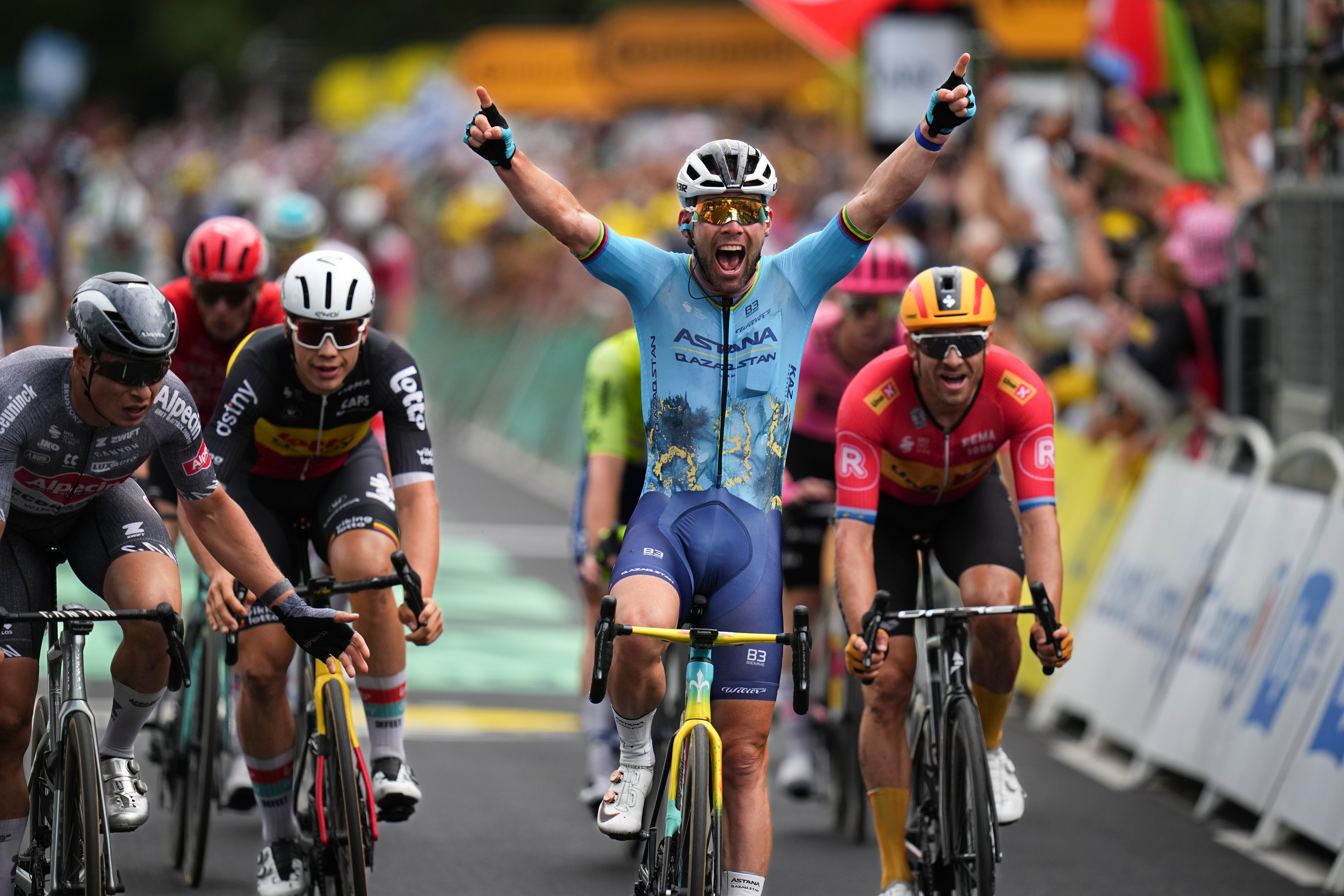 Mark Cavendish celebrates after clinching a record 35th Tour de France stage