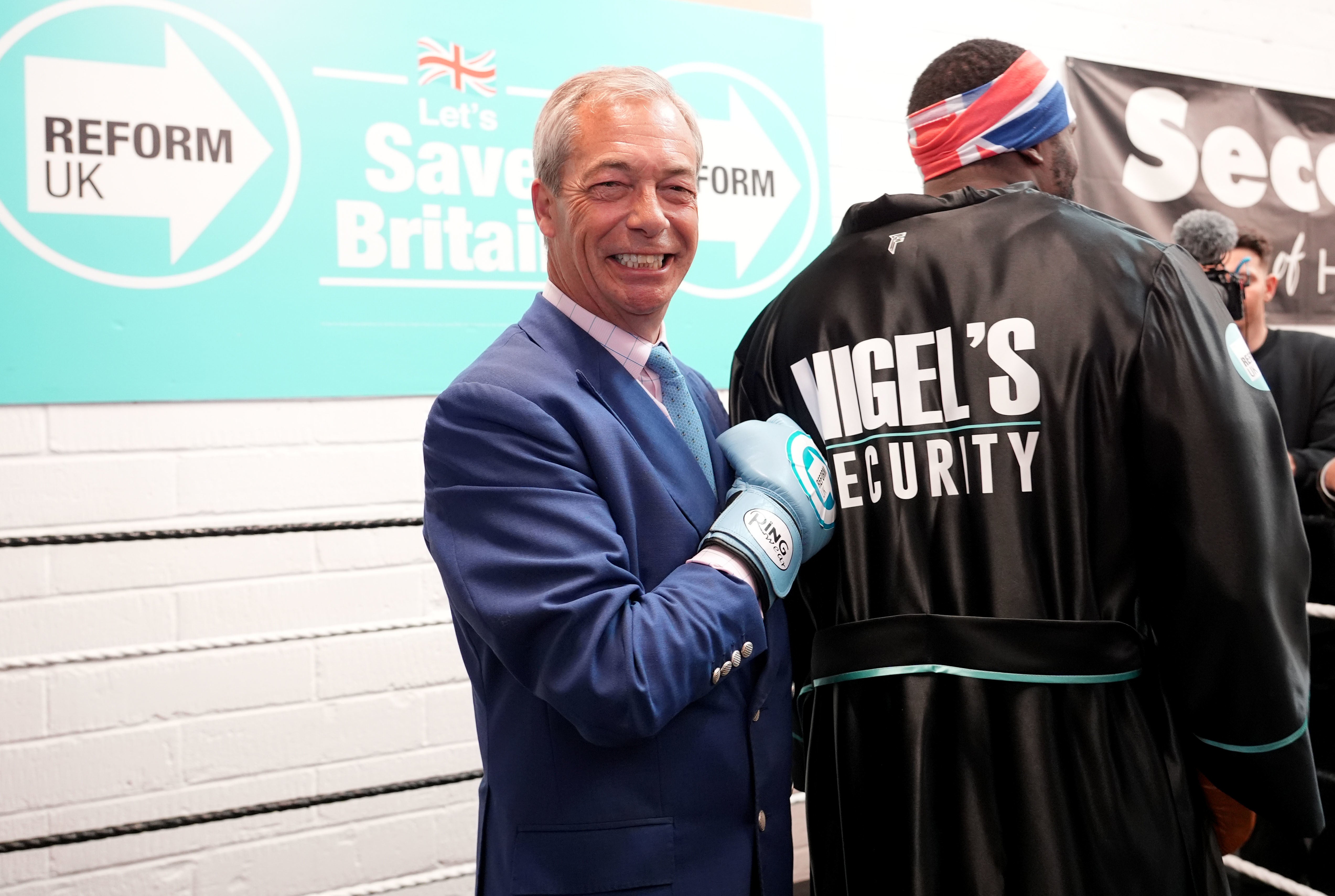 Nigel Farage with and boxer Derek Chisora (Ian West/PA)