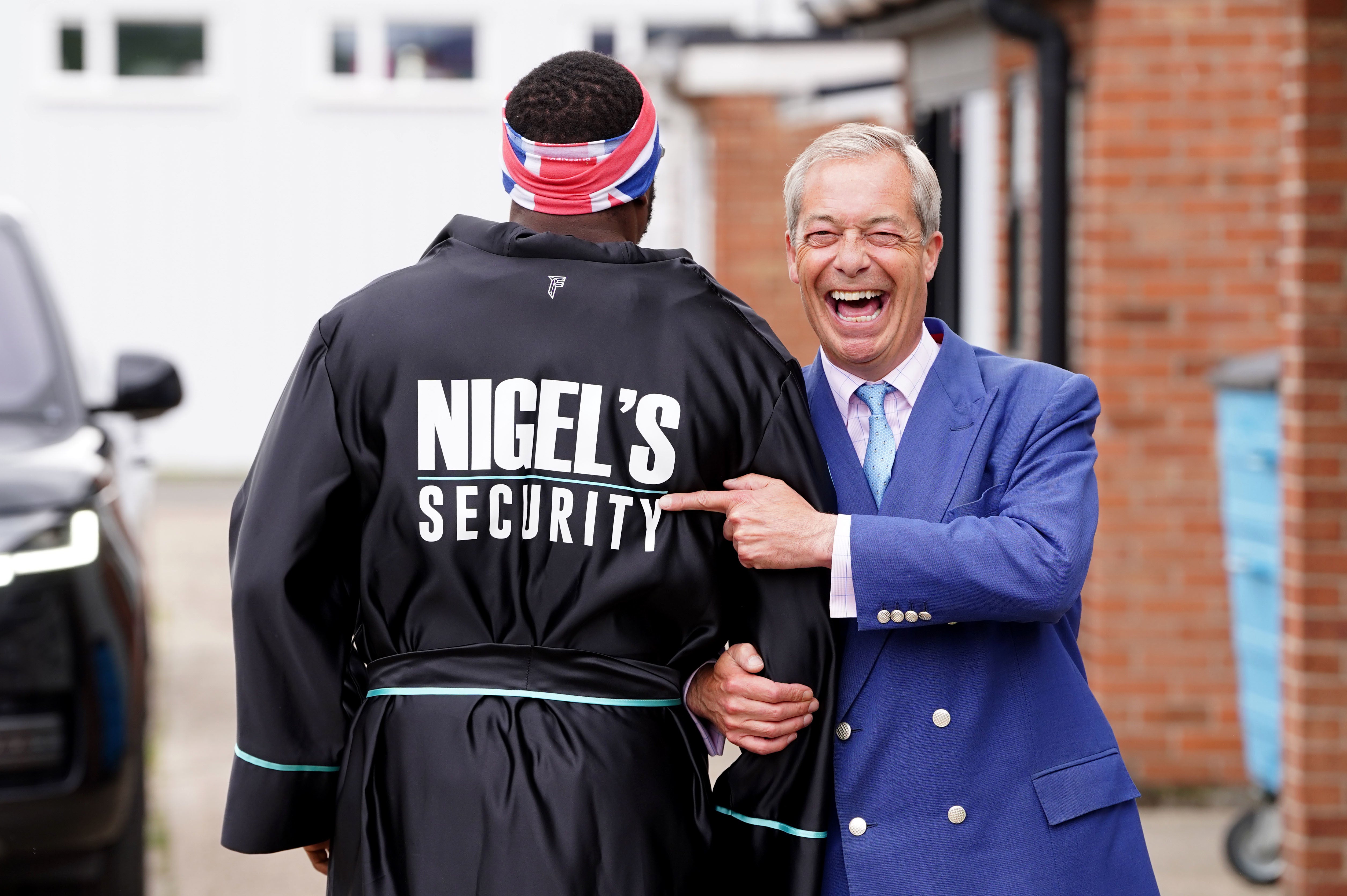 Reform UK leader Nigel Farage and boxer Derek Chisora (Ian West/PA)