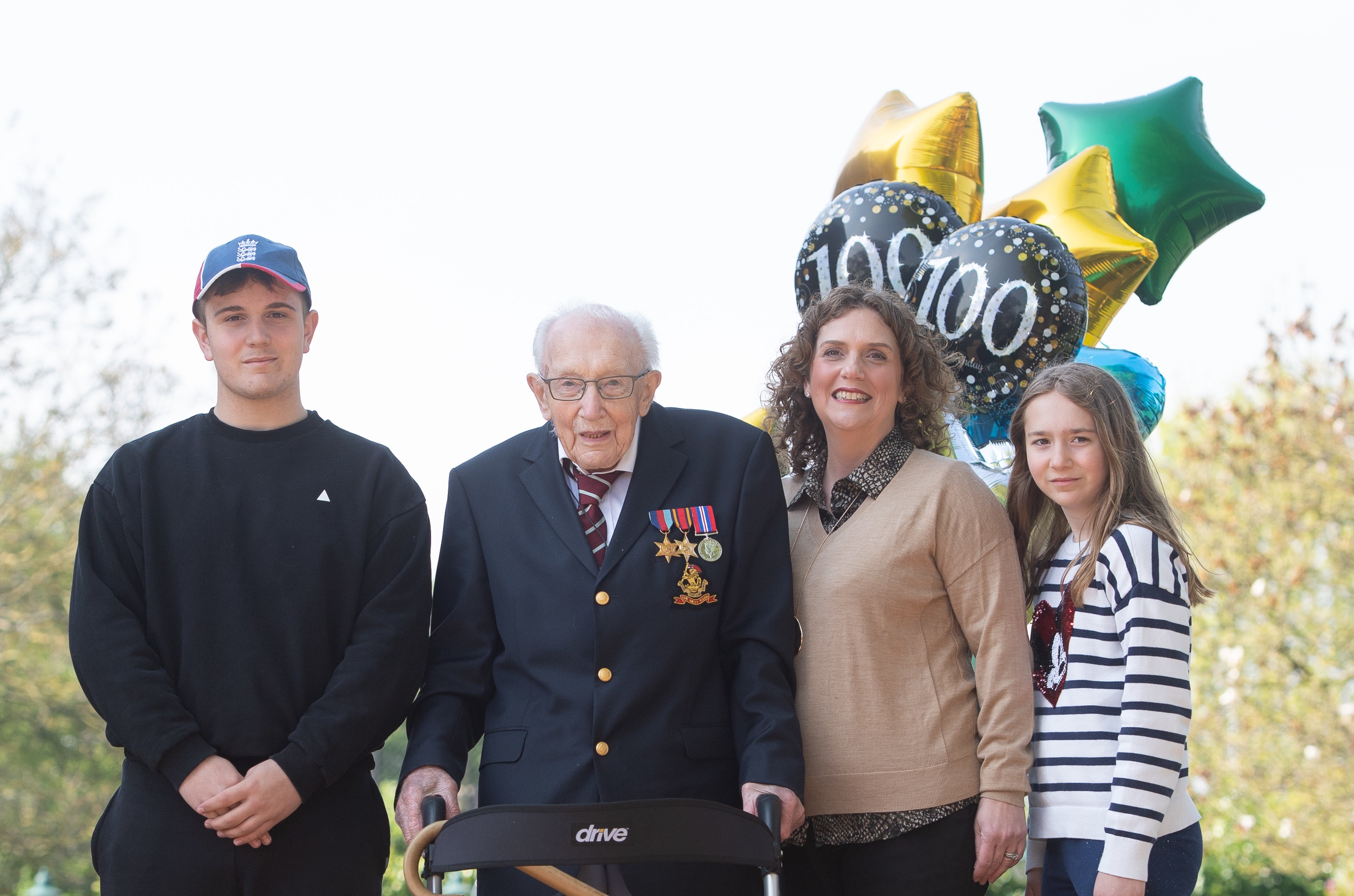 Captain Sir Tom Moore (second left) with his daughter Hannah Ingram-Moore (second right) (Joe Giddens/PA)