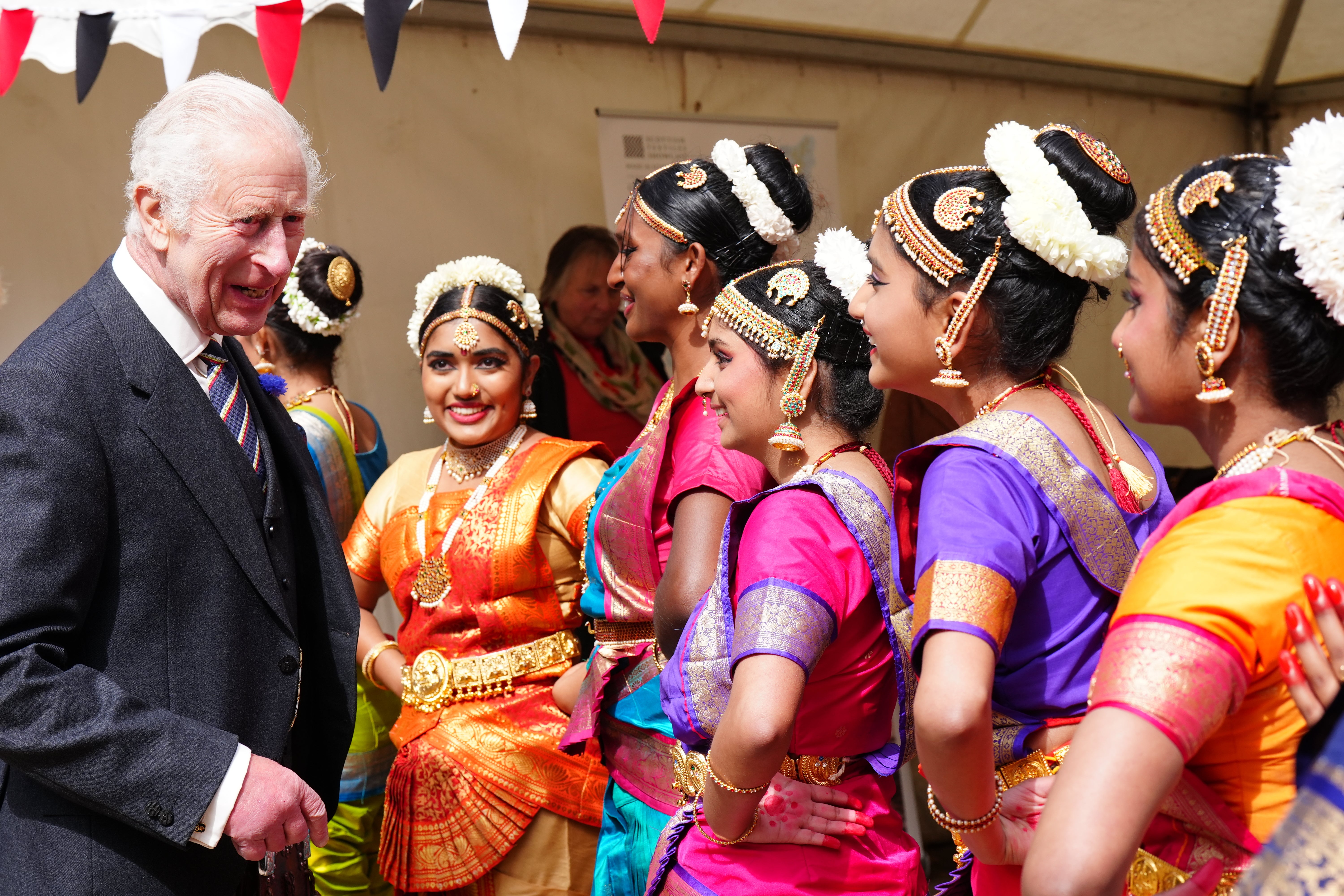 The King speaks to performers as he attends a celebration at Edinburgh Castle (Jane Barlow/PA)