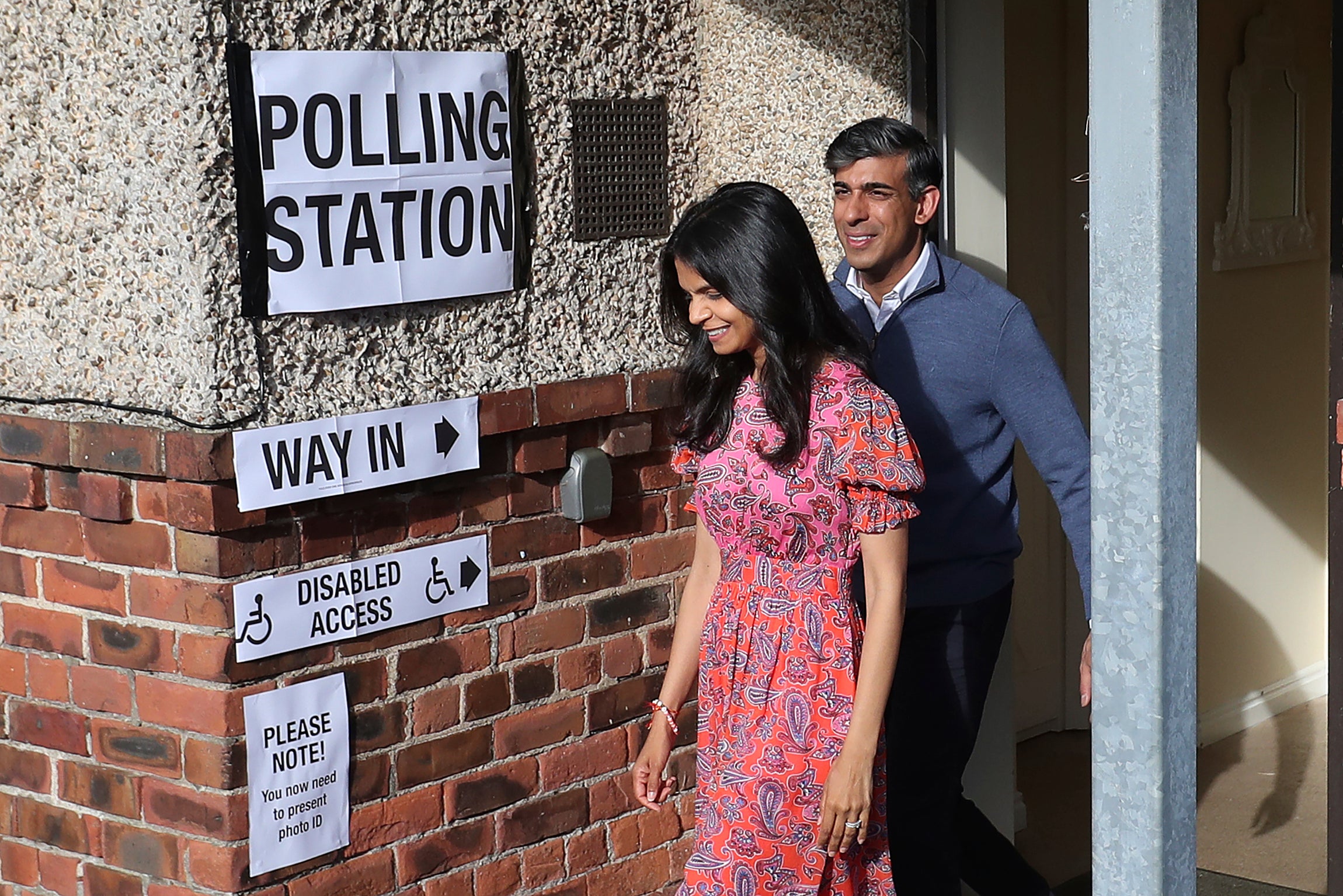 Britain’s Prime Minister Rishi Sunak and his wife Akshata Murty leave a polling station after voting near Richmond