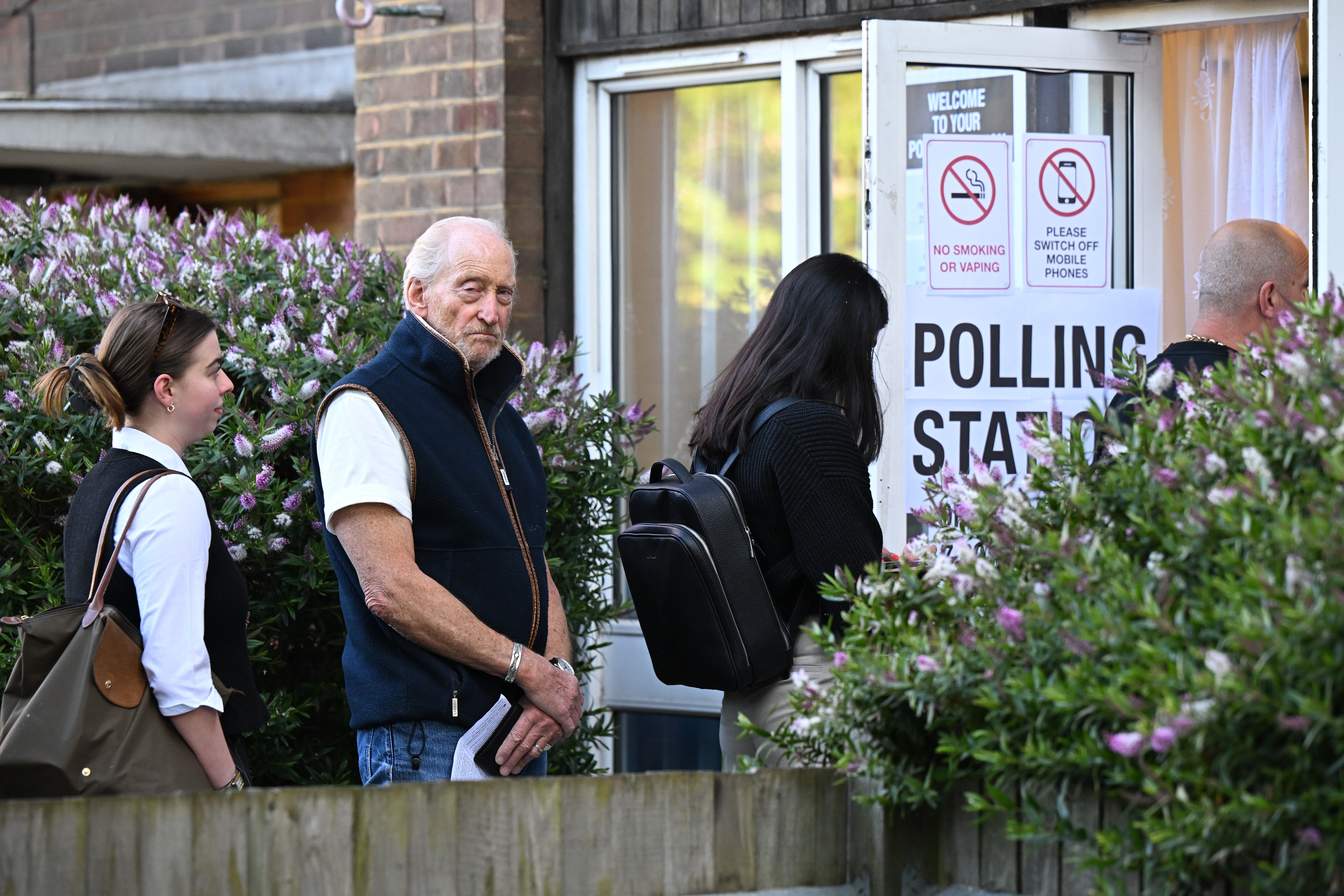 Actor Charles Dance queues to vote at a polling station in Kentish Town