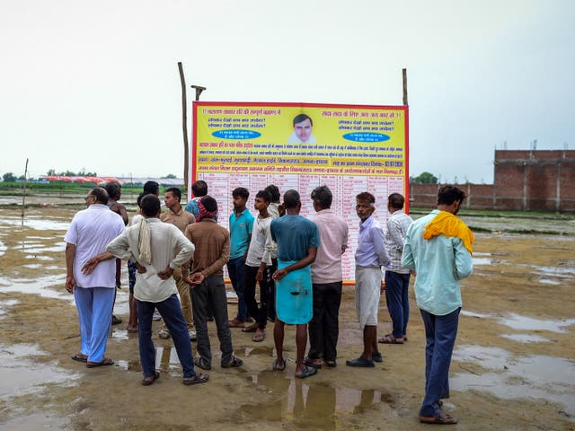 <p>People walk around the venue of the stampede a day after it occurred on 3 July 2024 in Hathras, India</p>