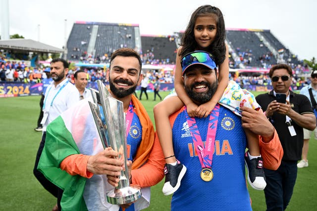 <p>Virat Kohli and Rohit Sharma of India celebrates with the ICC Men’s T20 Cricket World Cup following the ICC Men’s T20 Cricket World Cup West Indies & USA 2024 Final match between South Africa and India at Kensington Oval</p>