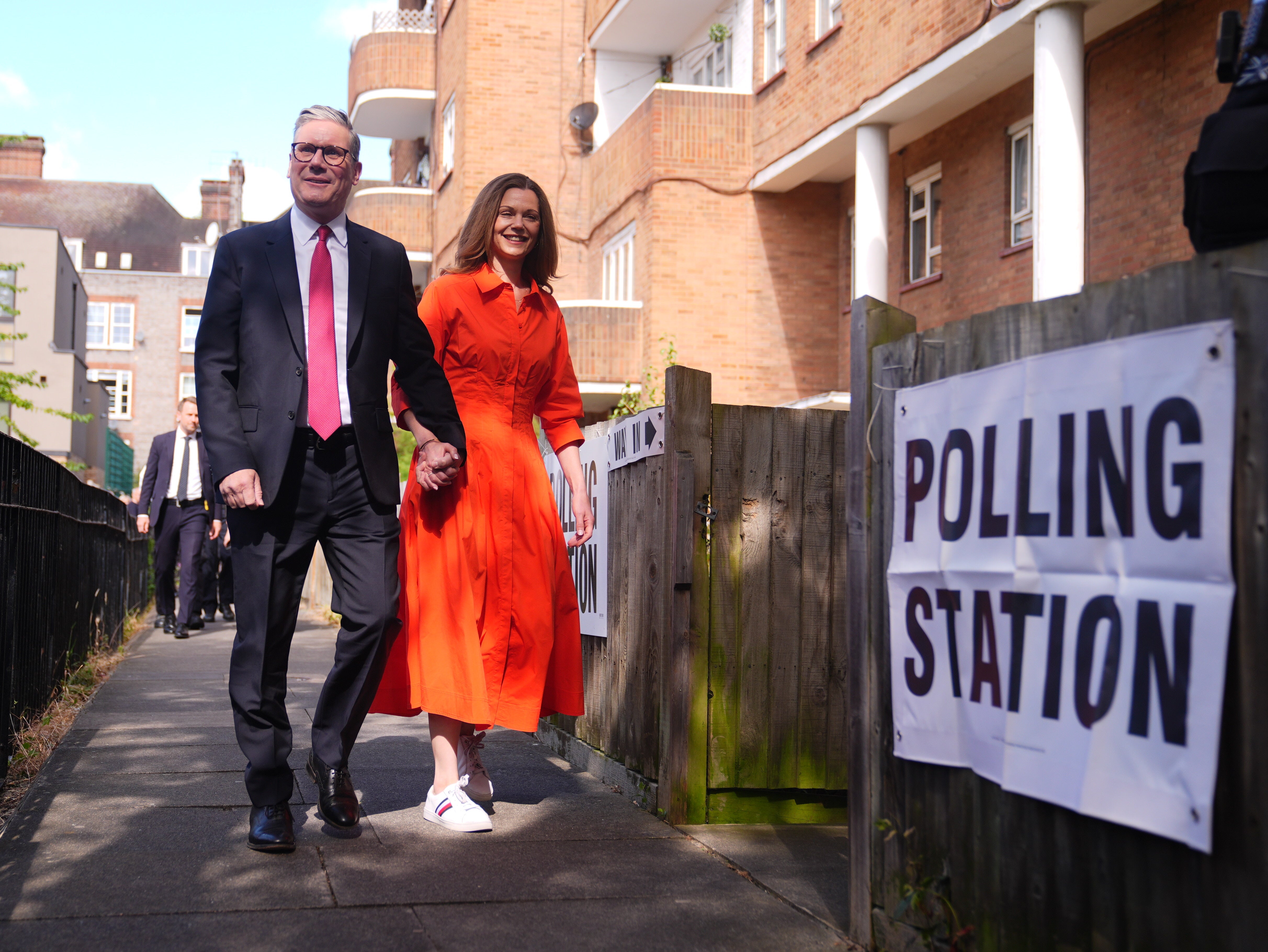 Sir Keir Starmer and his wife Victoria arrive to cast their votes in the 2024 General Election at Willingham Close TRA Hall in London.