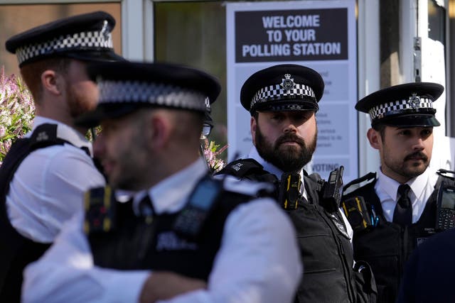 <p>Police officers at a polling station  </p>