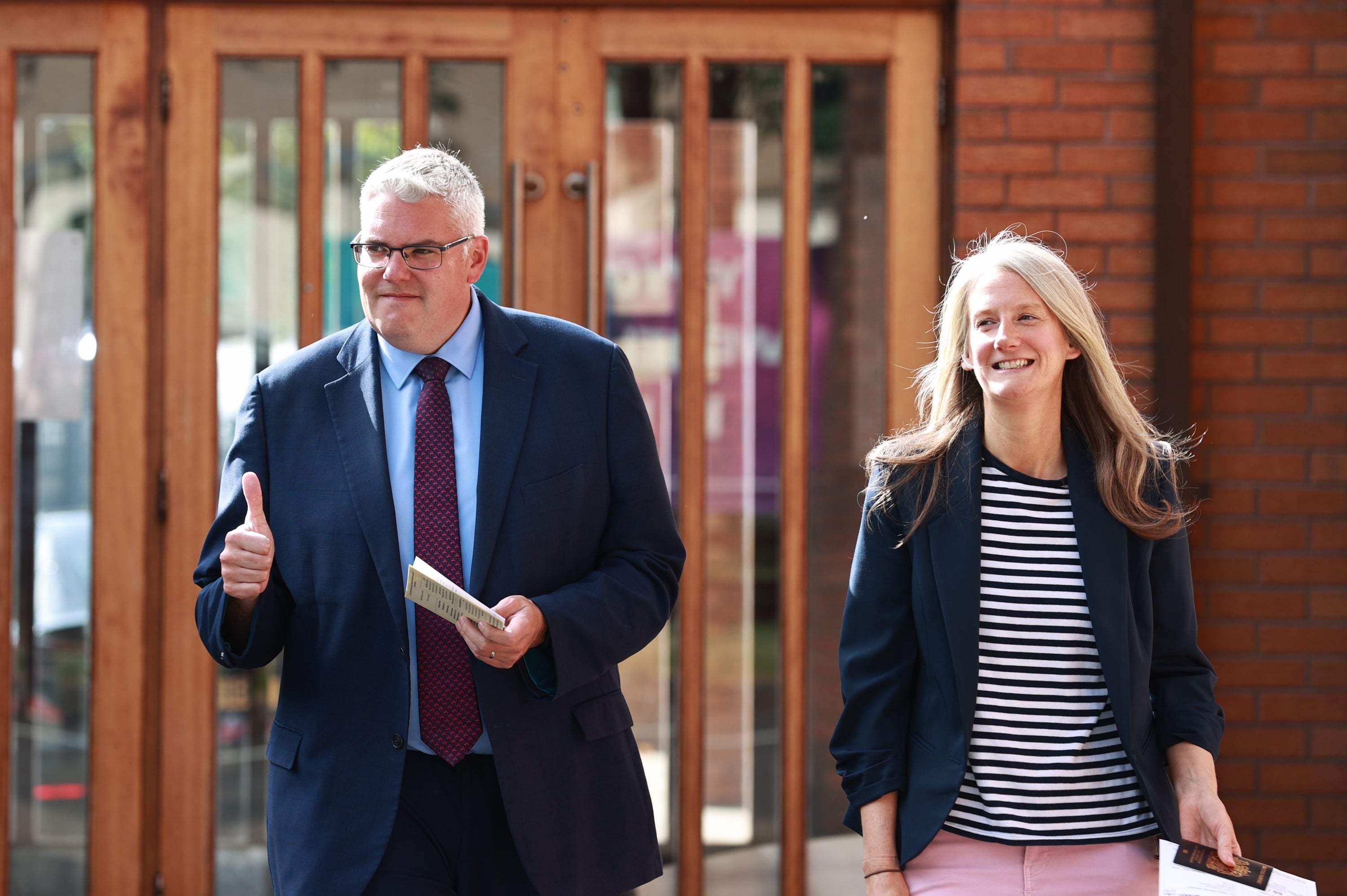 DUP leader Gavin Robinson and his wife Lindsay leave after casting their votes in the 2024 General Election at Dundonald Elim Church in Belfast (Liam McBurney/PA)
