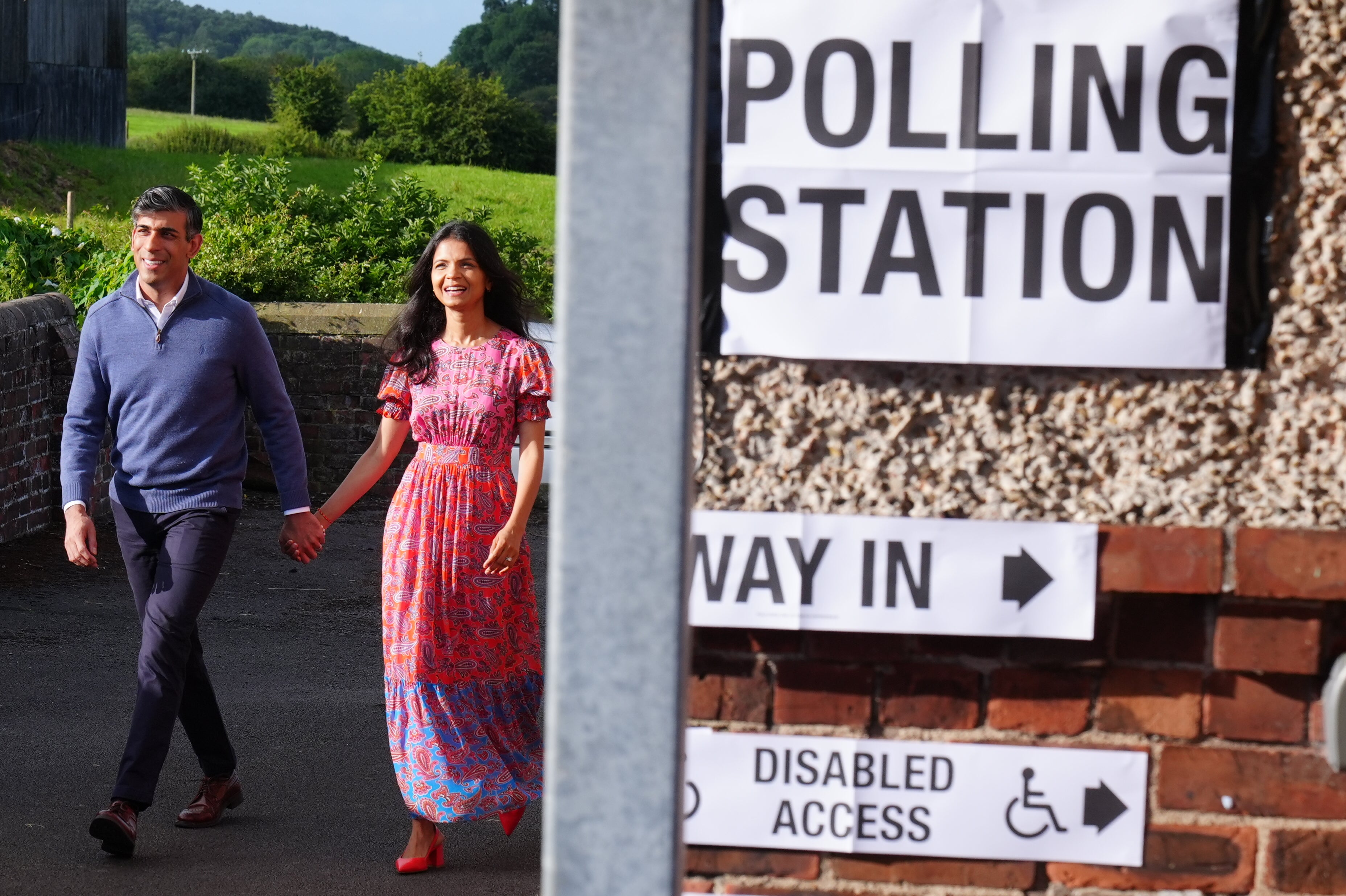 Prime Minister Rishi Sunak and his wife Akshata Murty arrive to cast their votes in Northallerton