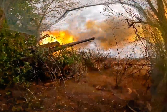 <p>Russian soldiers fire from their 152-mm Giatsint-B howitzer from their position at Ukrainian troops at an undisclosed location in Ukraine</p>