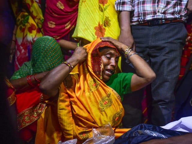 <p>Relatives mourn victims of the Hathras stampede during a cremation ceremony at Daukeli village  in Hathras, India</p>