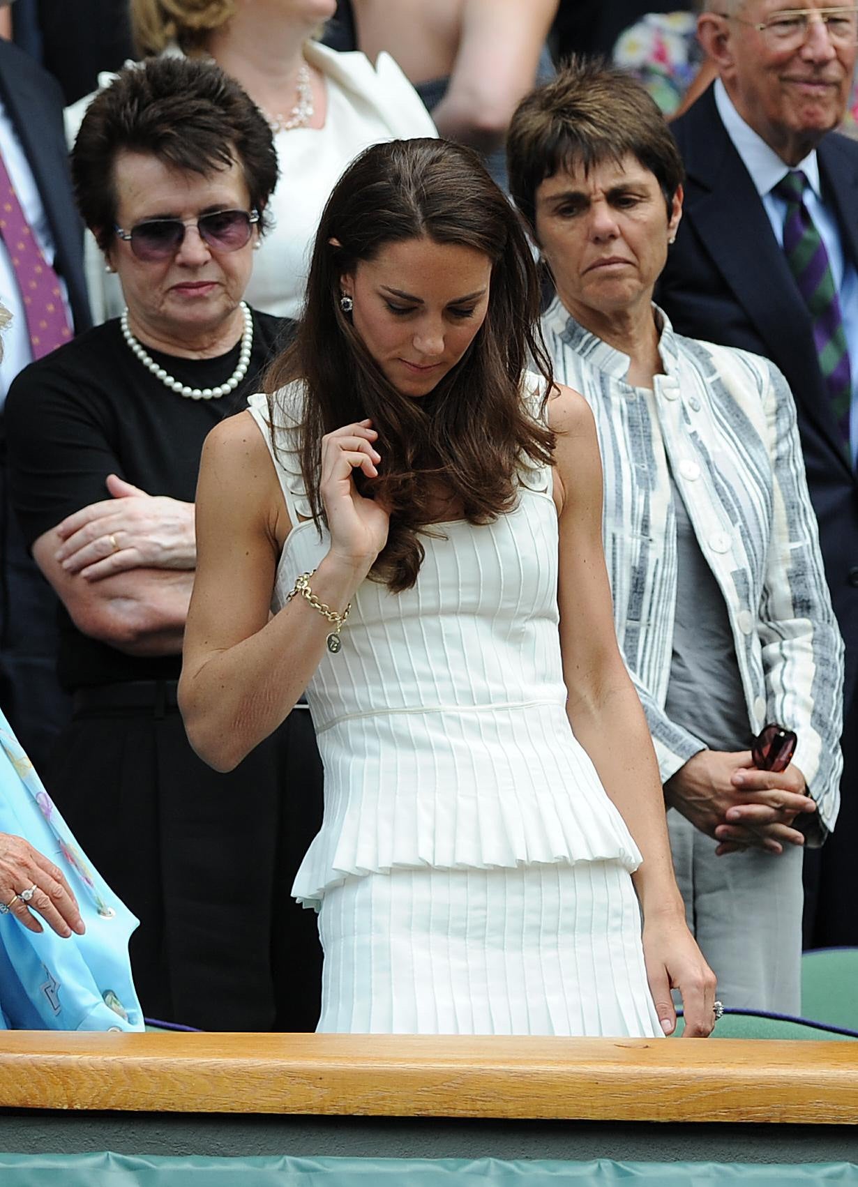 The Princess of Wales wore a pleated pinstripe-inspired dress to her first Wimbledon as a member of the royal family (Anthony Devlin/PA)