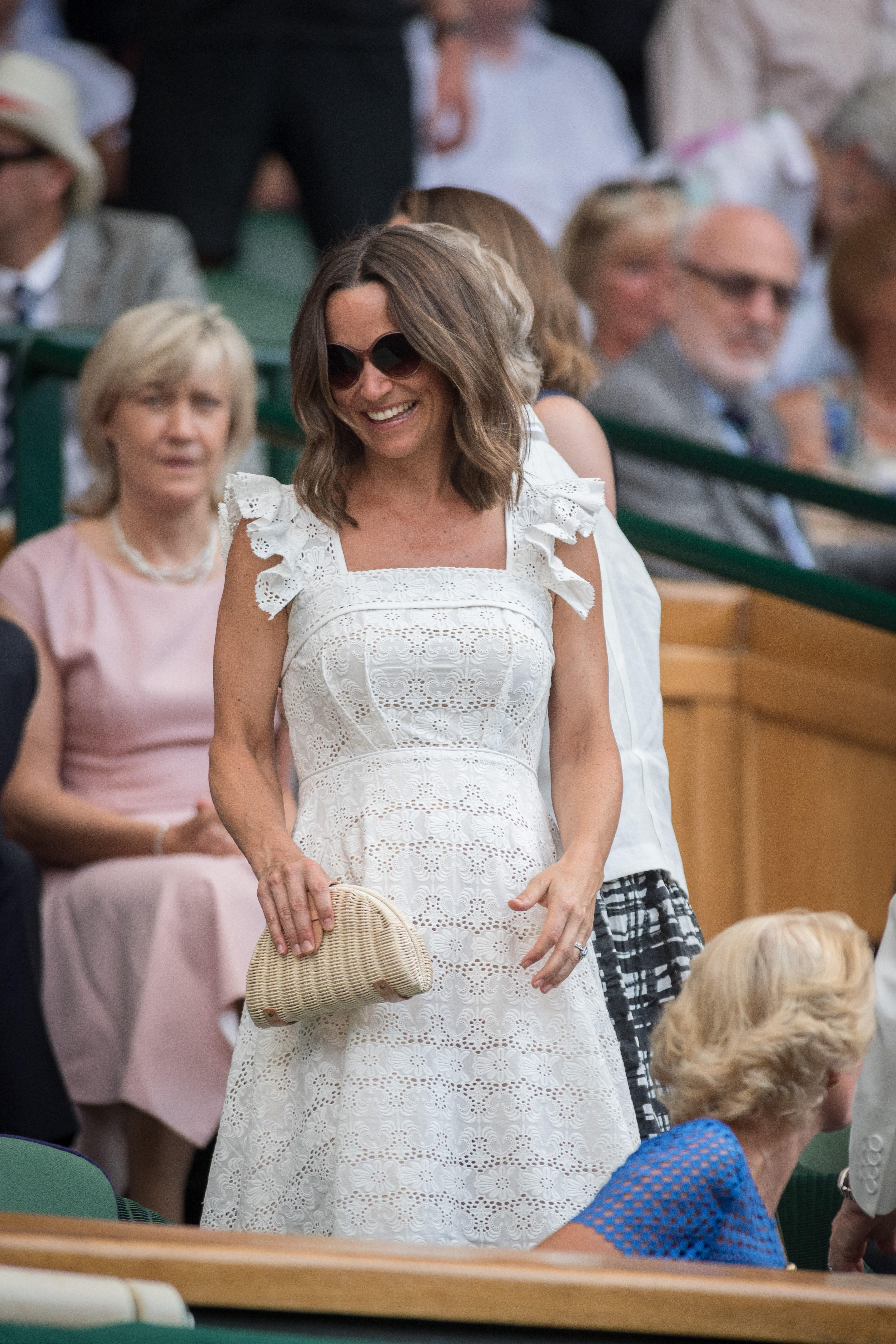 Pippa Middleton, sister of the Princess of Wales, wore a lace square-neck white sundress to Wimbledon 2018 (Alamy/PA)Pippa Middleton t