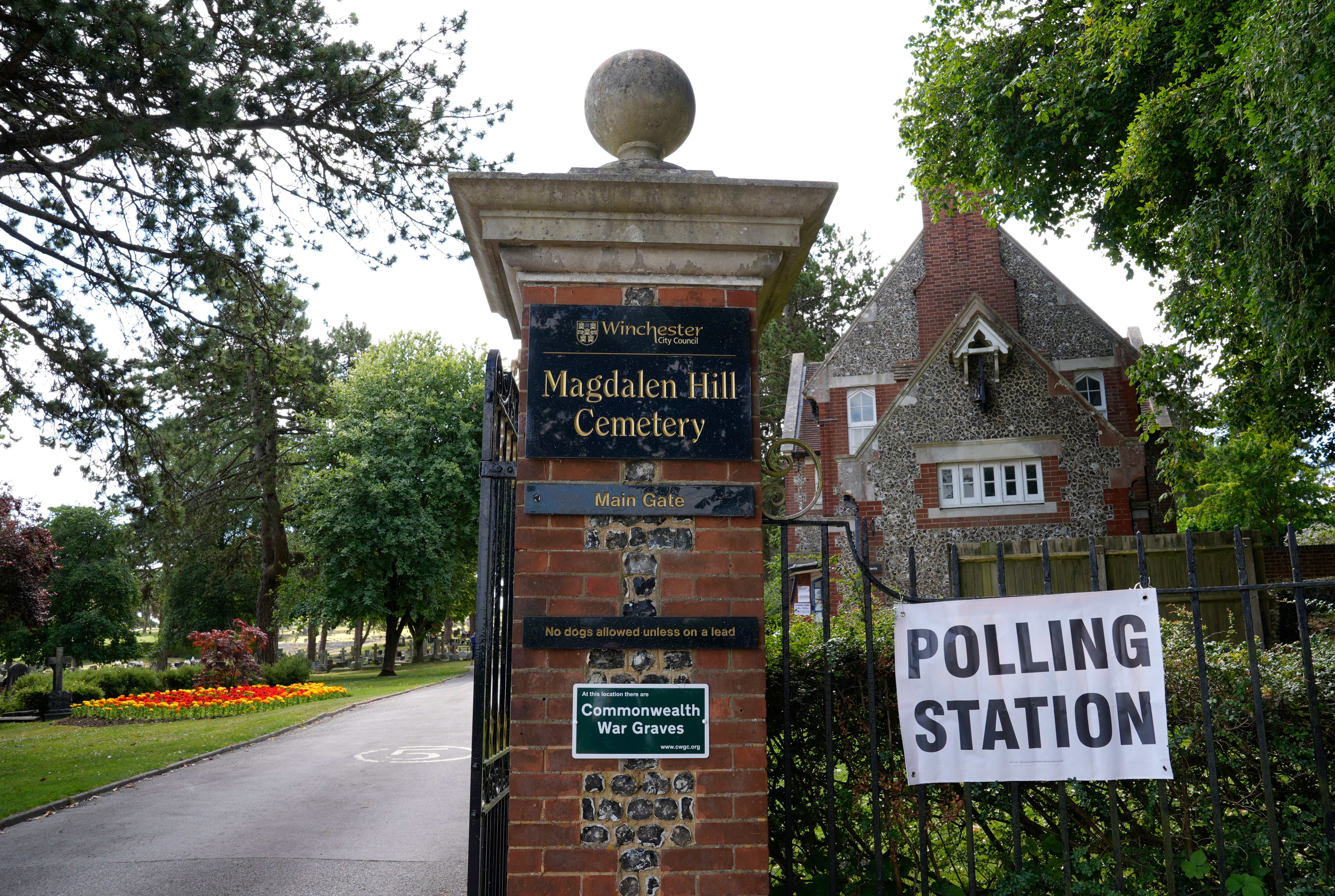 A sign for a polling station at Magdalen Hill Cemetery near Winchester, Hampshire