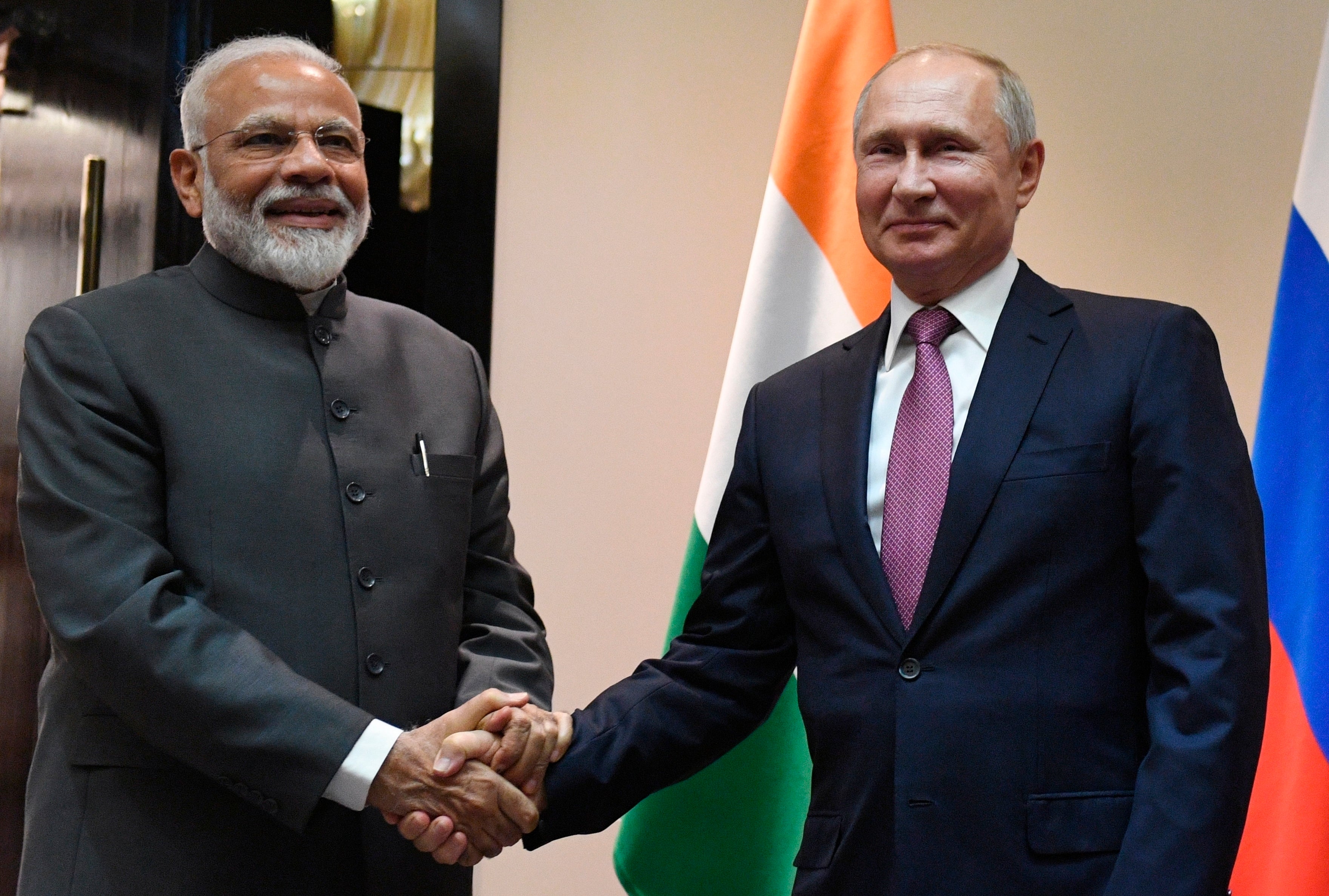 Russian President Vladimir Putin, right, and Indian Prime Minister Narendra Modi pose for a photo in 2019
