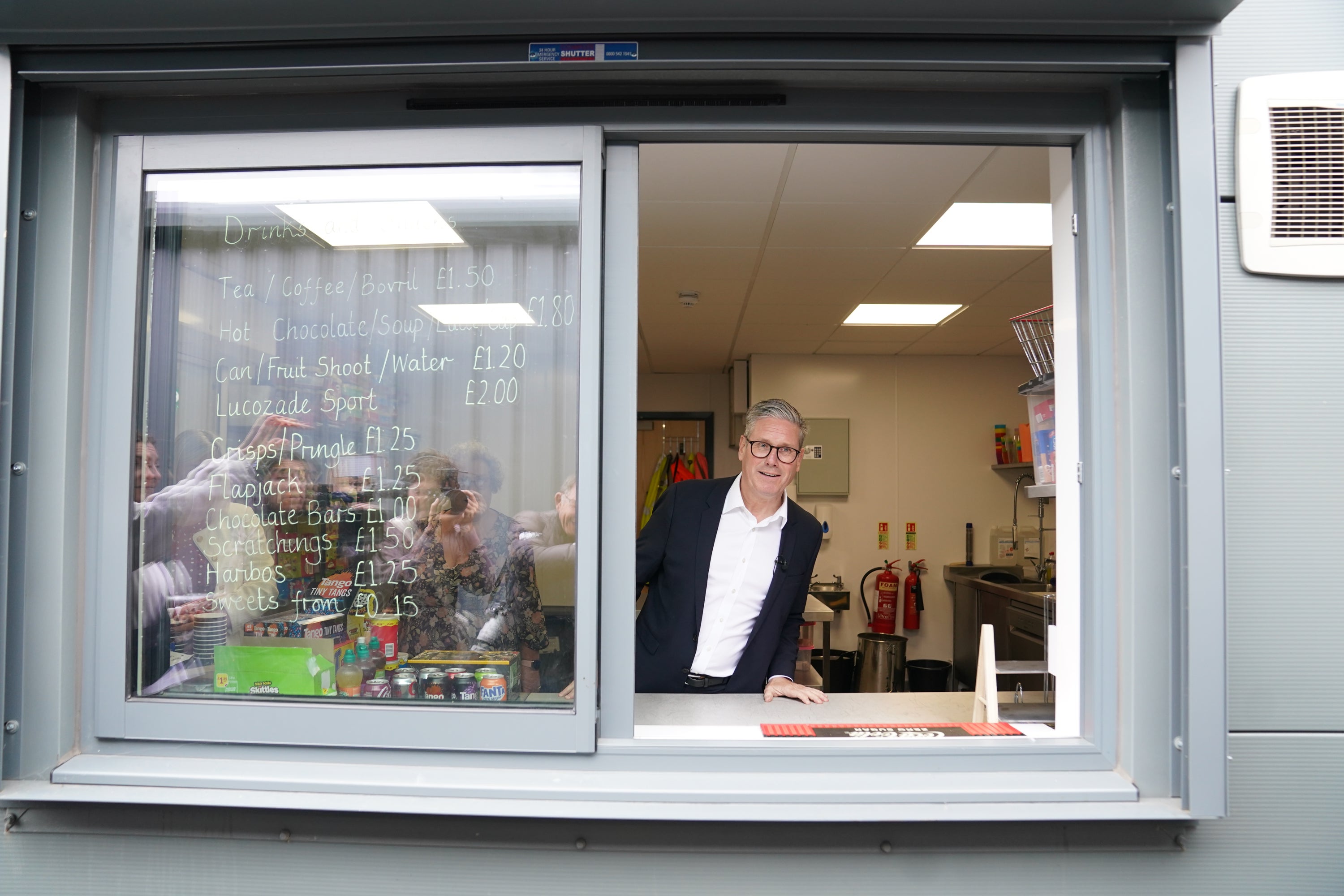 Sir Keir was on hand to dole out drinks during a visit to Hucknall Town FC in Nottinghamshire, as campaigning came to an end (Stefan Rousseau/PA)