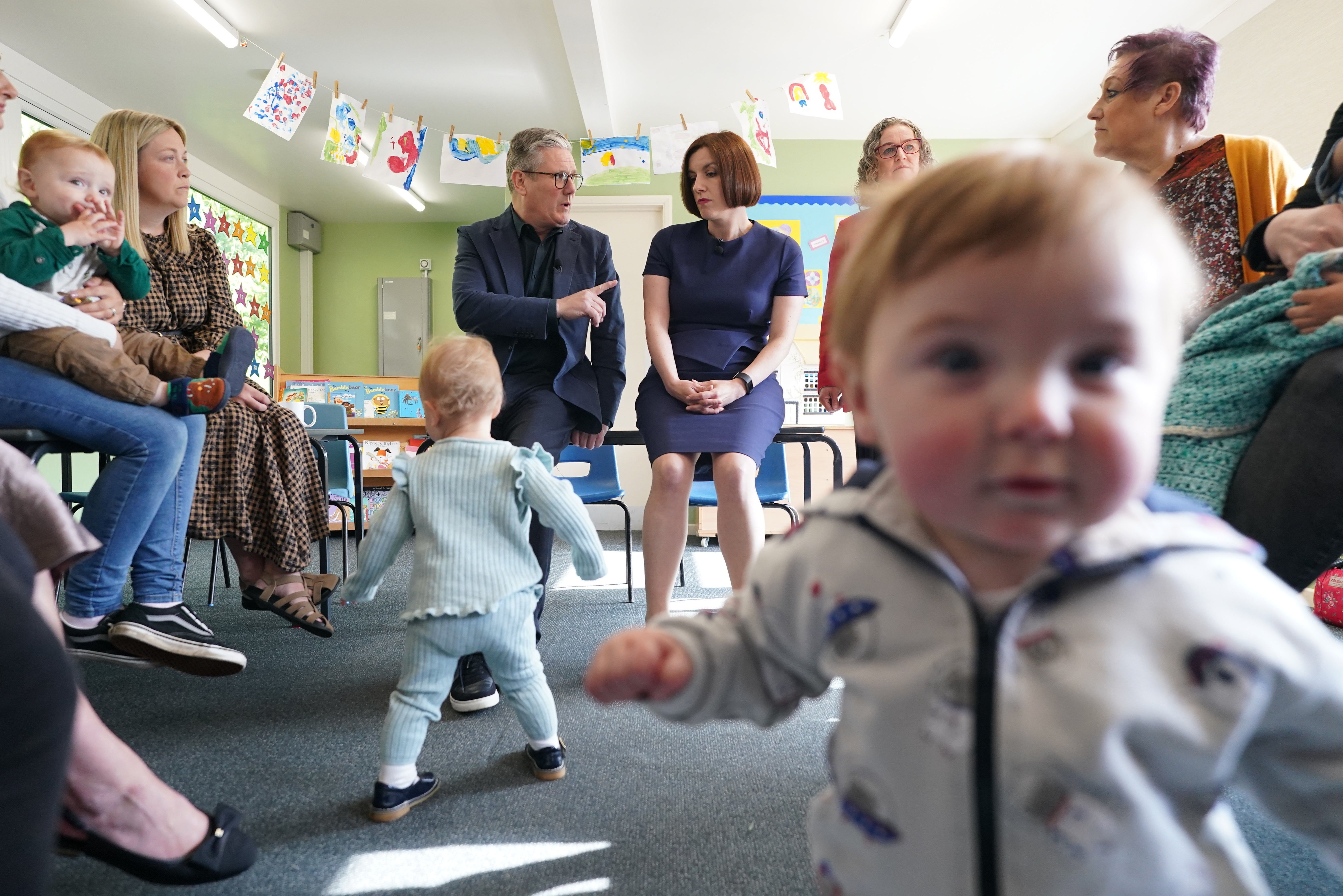 Sir Keir and shadow education secretary Bridget Phillipson were photo-bombed as they met future voters during a visit to Nursery Hill Primary School, in Nuneaton (Stefan Rousseau/PA)