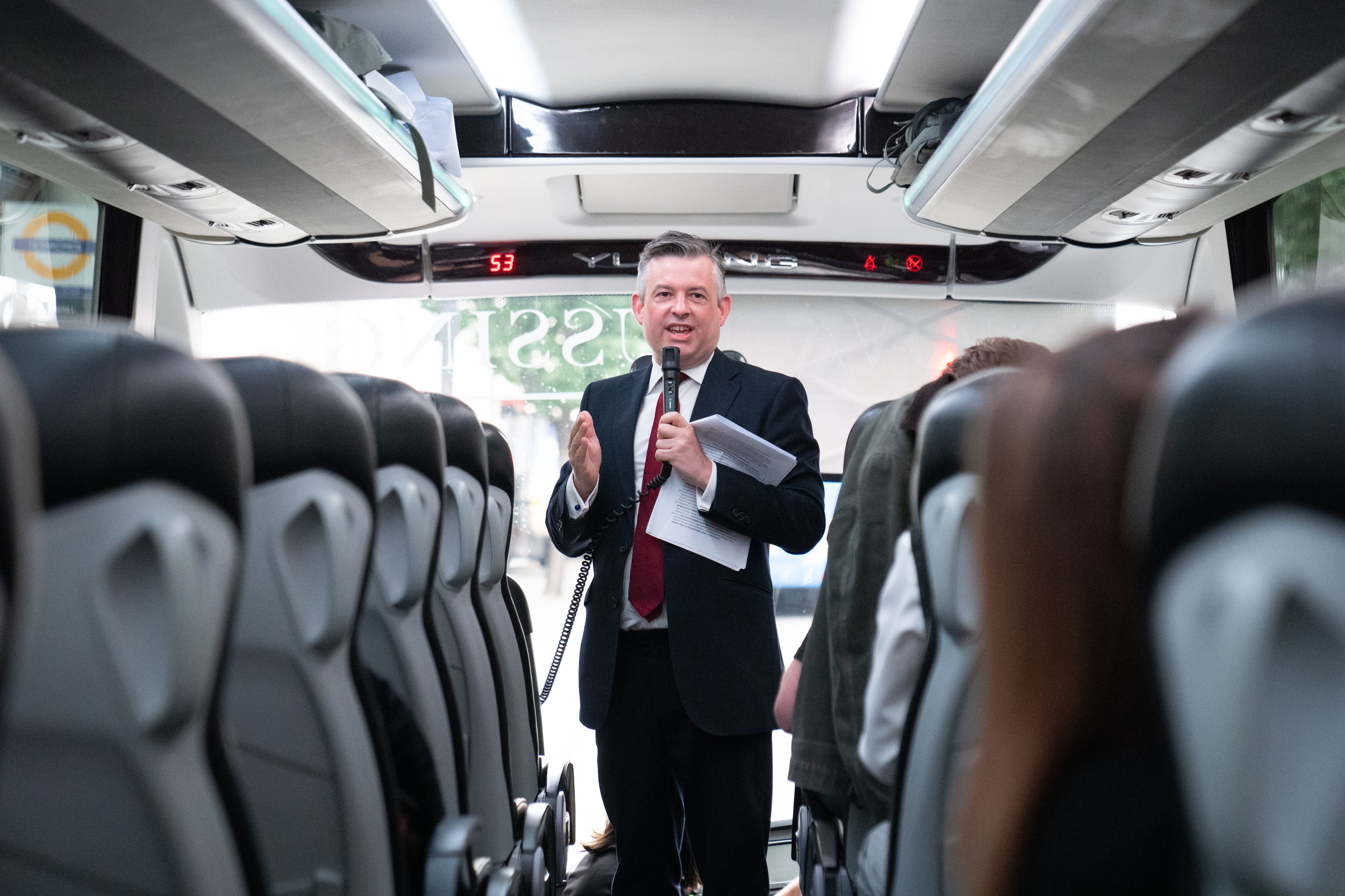 All aboard! Shadow paymaster general Jonathan Ashworth briefed journalists on the Labour Party battle bus as it headed out on the campaign trail (Stefan Rousseau/PA)