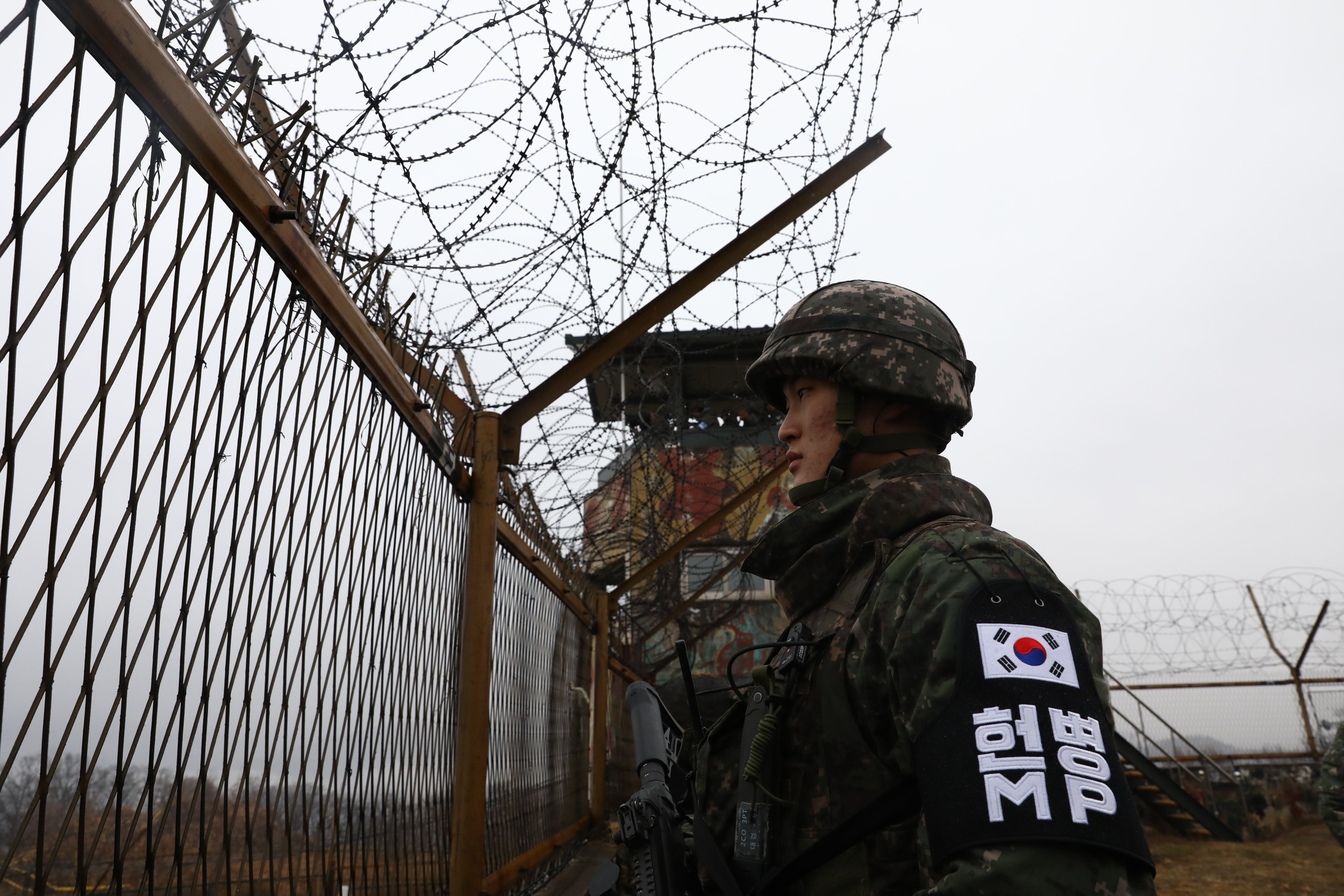 A South Korean soldier looks at North Korea at a border guard post