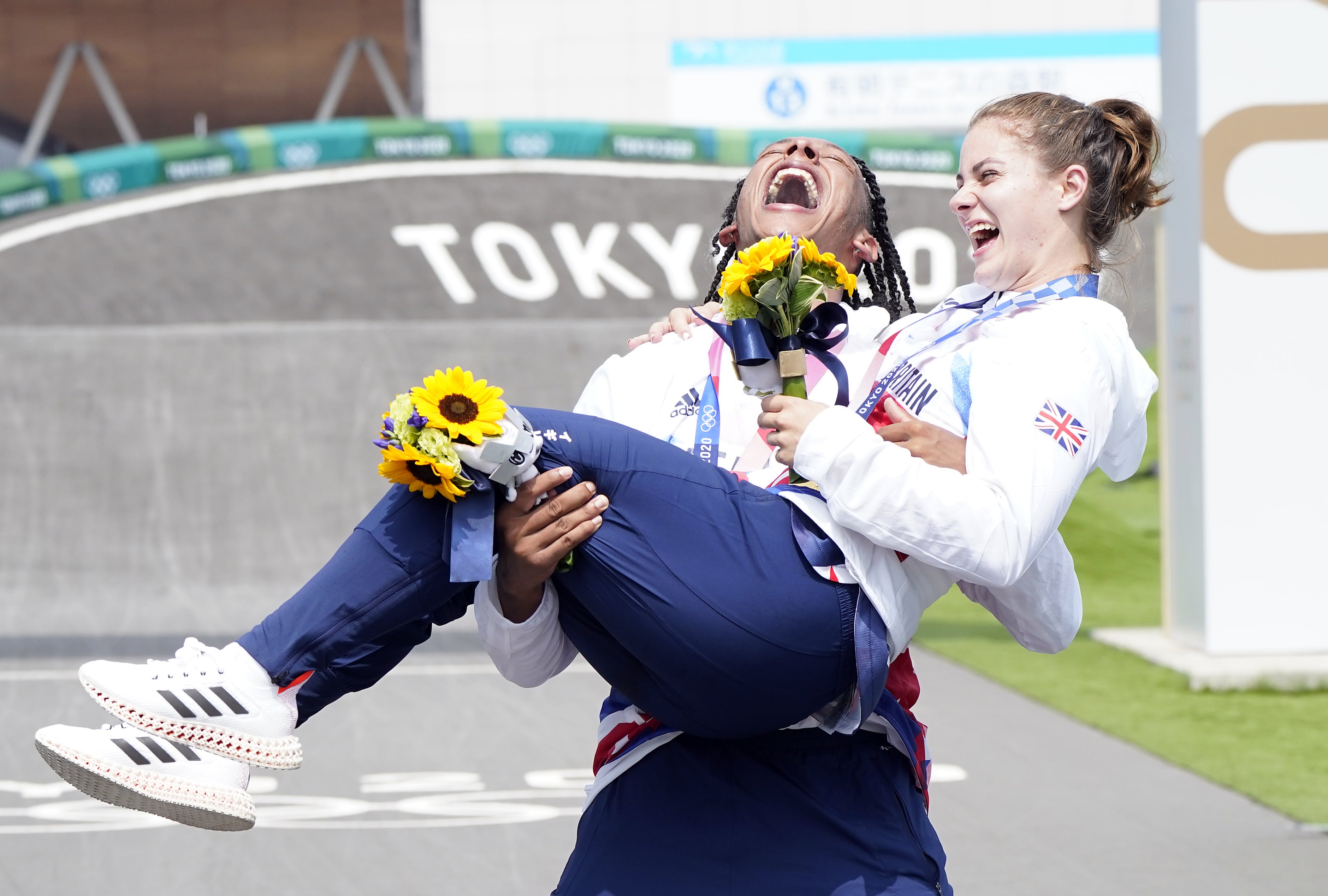 Beth Shriever is held aloft by team-mate Kye Whyte after her victory at the Tokyo Olympics (Danny Lawson/PA)