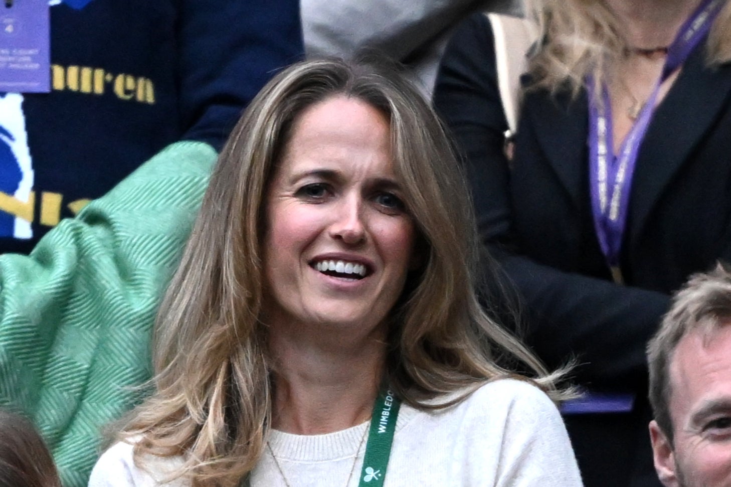 Kim Murray looks on as her husband says farewell to Wimbledon