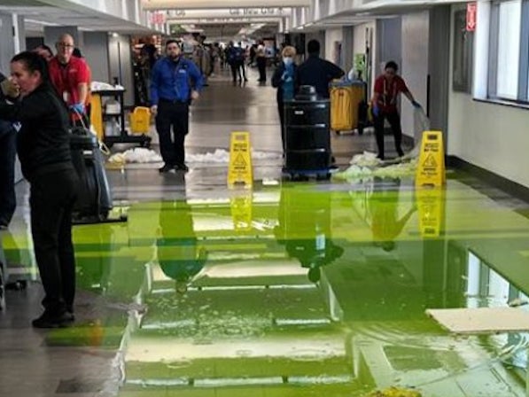 Green liquid flooded Concourse G at the Miami International Airport on July 4
