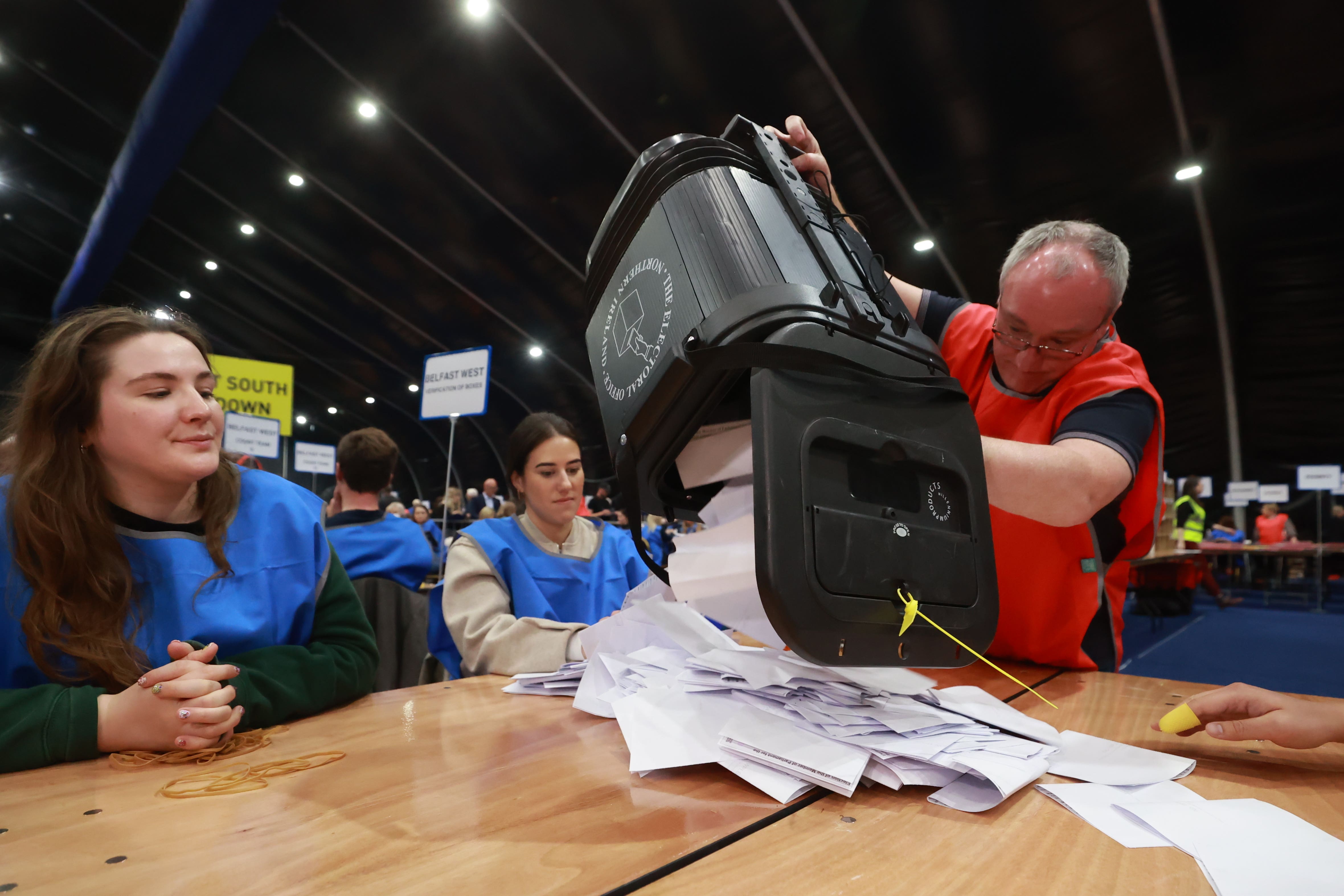 A ballot box is emptied at the Titanic Exhibition Centre, Belfast (PA)