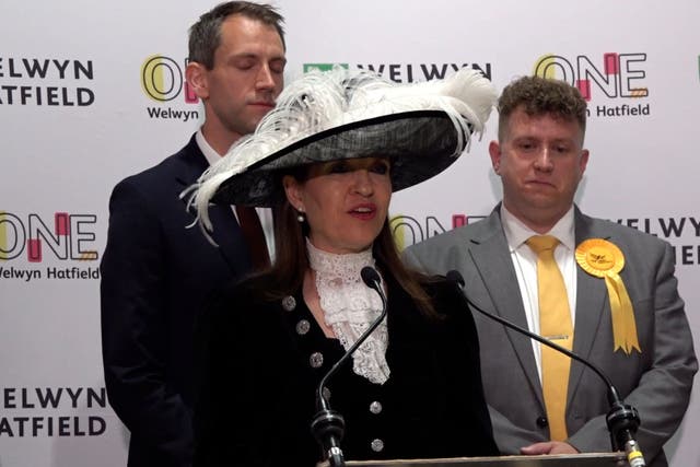 Returning officer Annie Brewster donned a large brimmed hat to declare the result for Welwyn Hatfield (Elena Giuliano/PA)