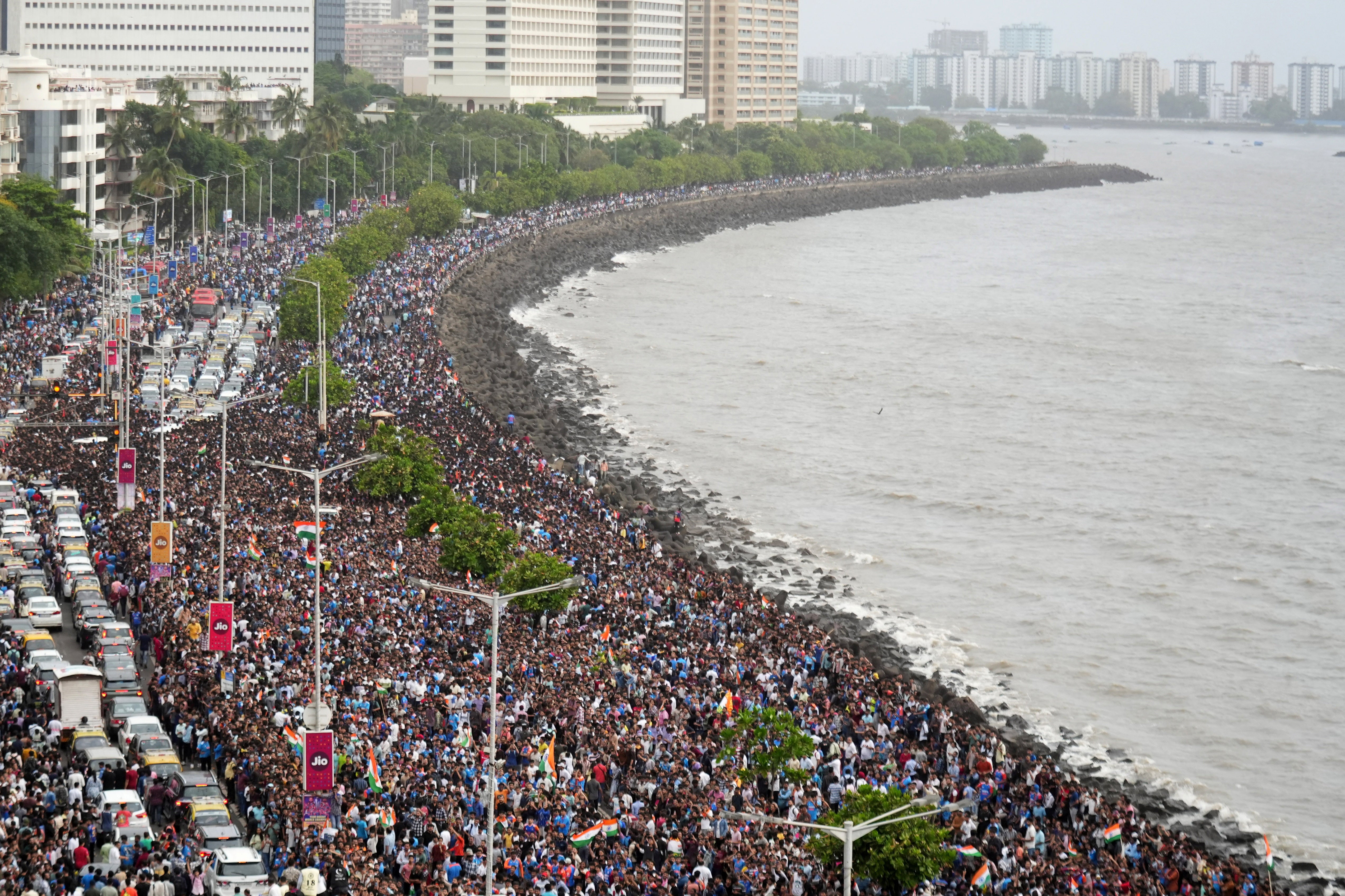 Fans wait for the arrival of Indian cricket players for a victory parade in Mumbai
