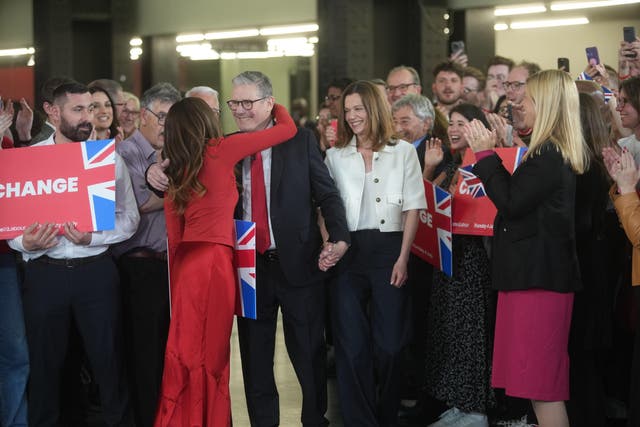 Labour leader Sir Keir Starmer and his wife Victoria are surrounded by supporters (PA)
