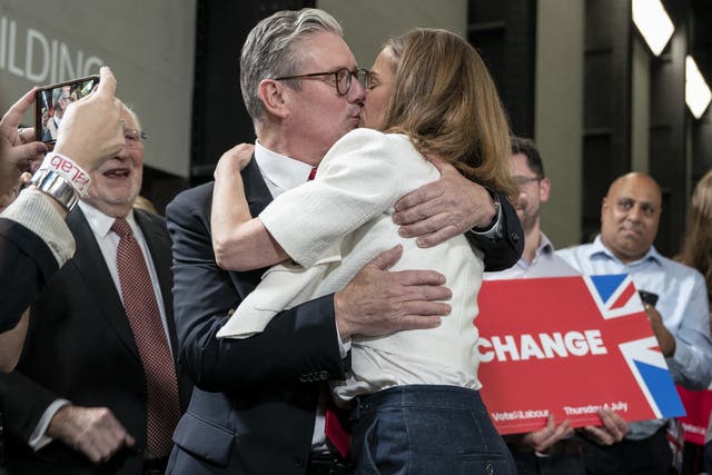 <p>Sir Keir Starmer embraces his wife, Victoria, in front of cheering crowds in the Tate Modern’s Turbine Hall (Jeff Moore/PA)</p>