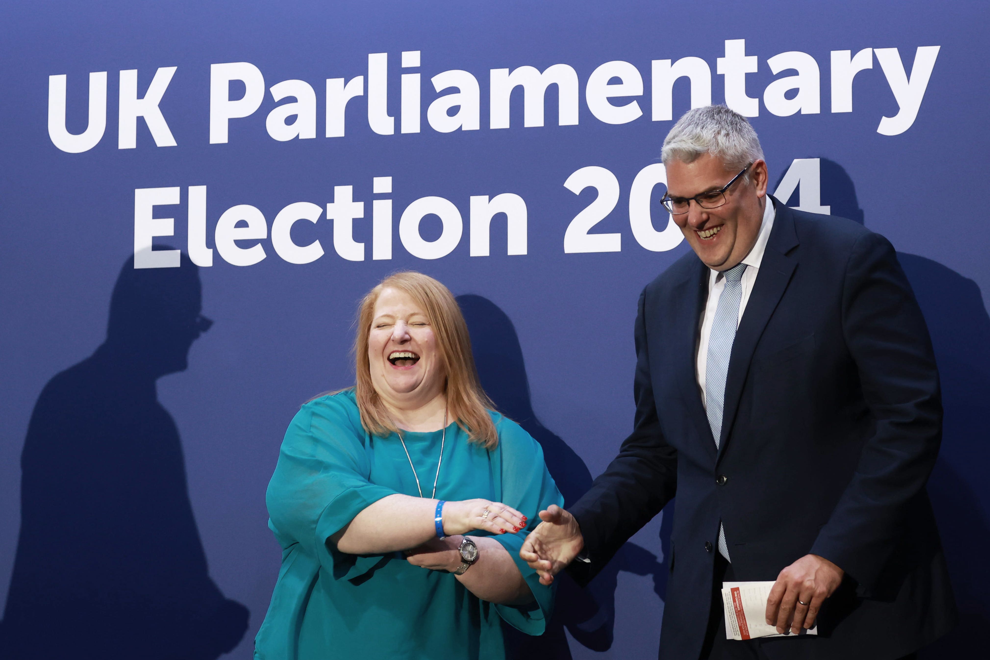 DUP leader Gavin Robinson shakes hands with Alliance Party leader Naomi Long after retaining his seat in the East Belfast constituency (Liam McBurney/PA)