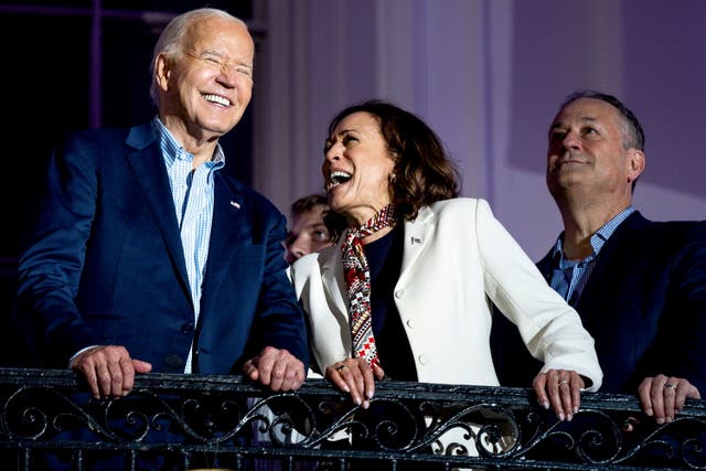 <p>Joe Biden, Kamala Harris and Doug Emhoff together on the White House balcony on July 4 </p>