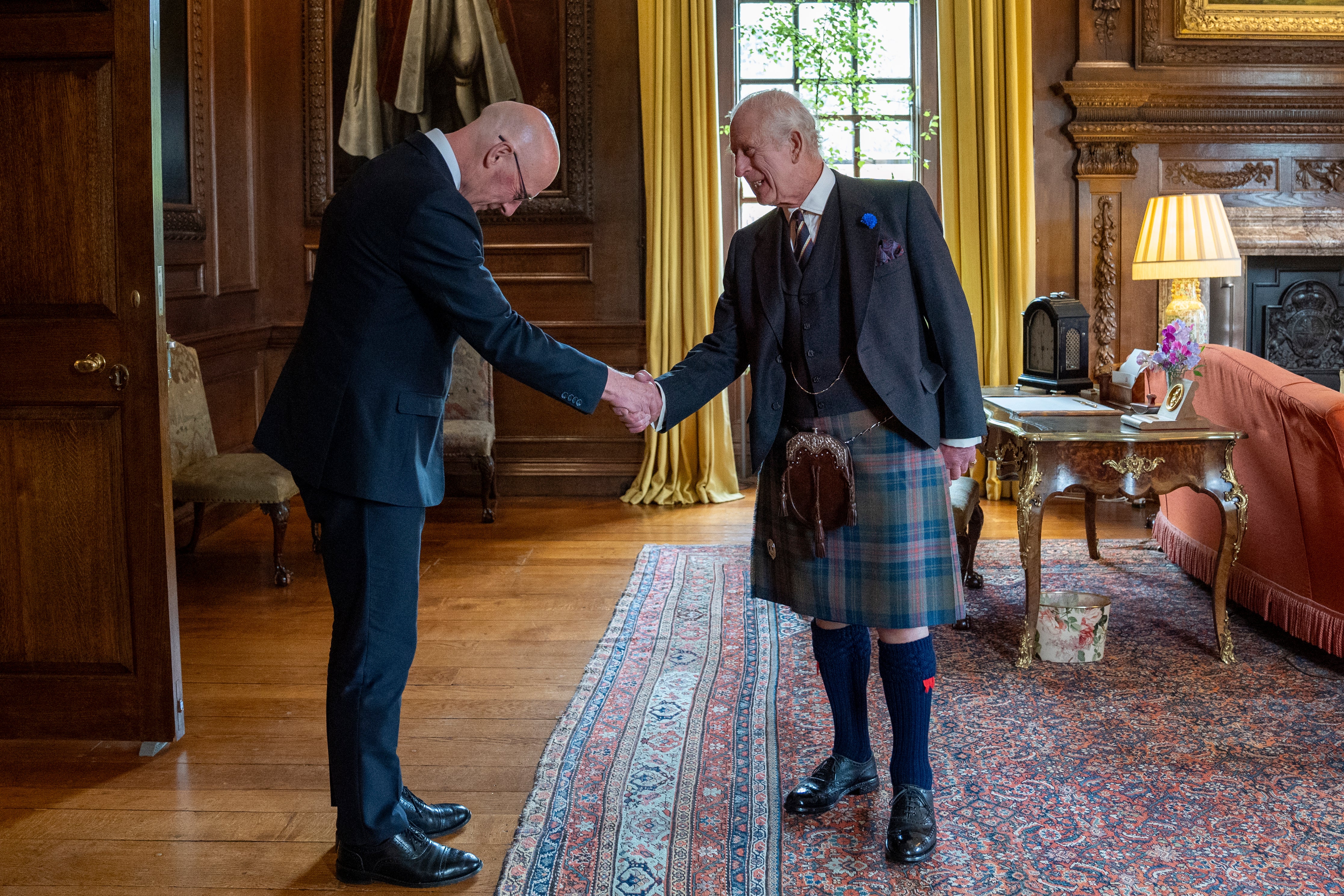 The SNP leader was pictured bowing to the Monarch.