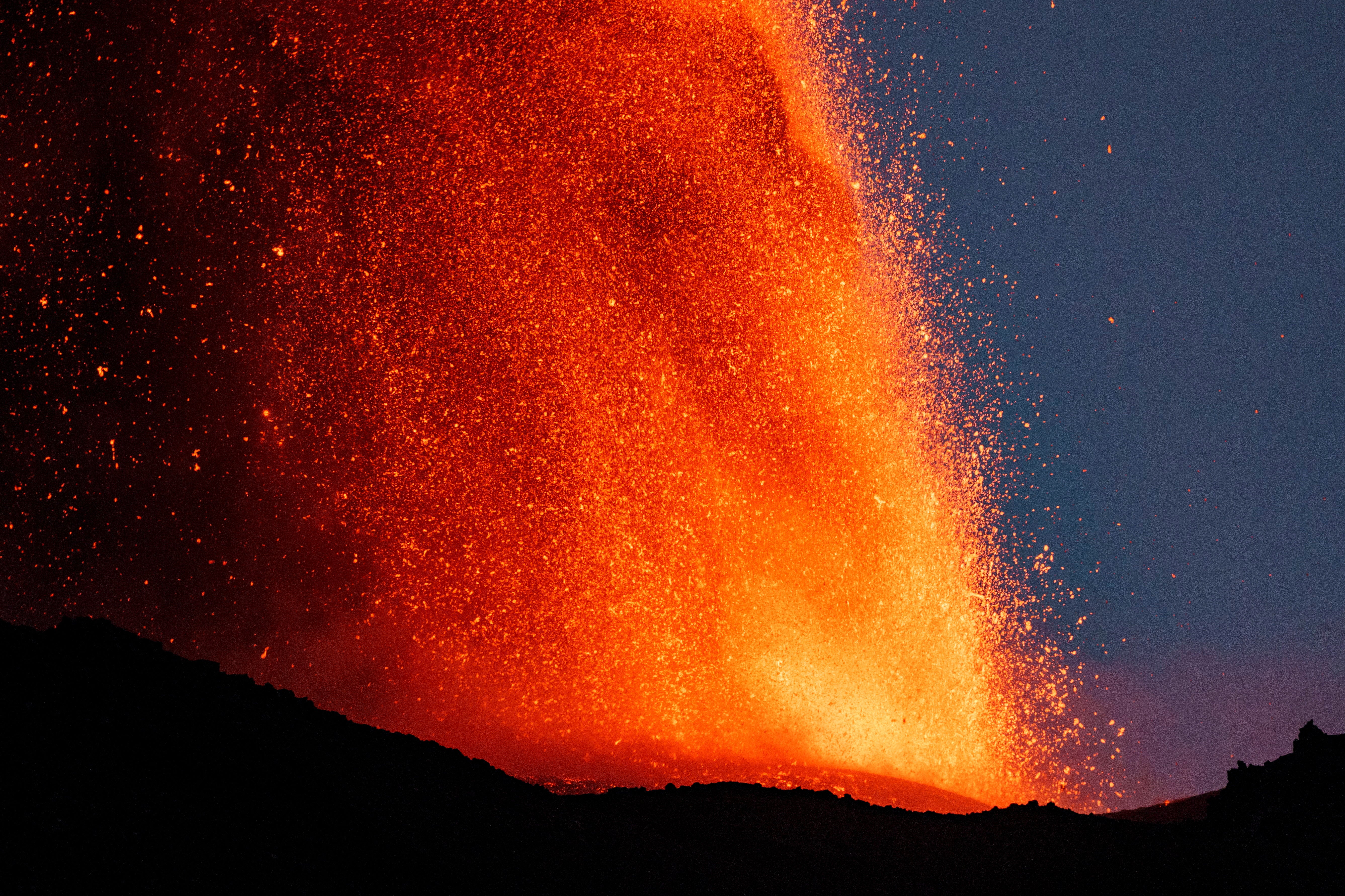 Lava rises from a crater of Mount Etna, Europe’s most active volcano