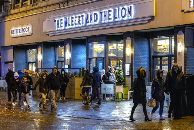 People outside a Wetherspoons pub in Blackpool. The pub group is set to update investors on Wednesday (Peter Byrne/PA)