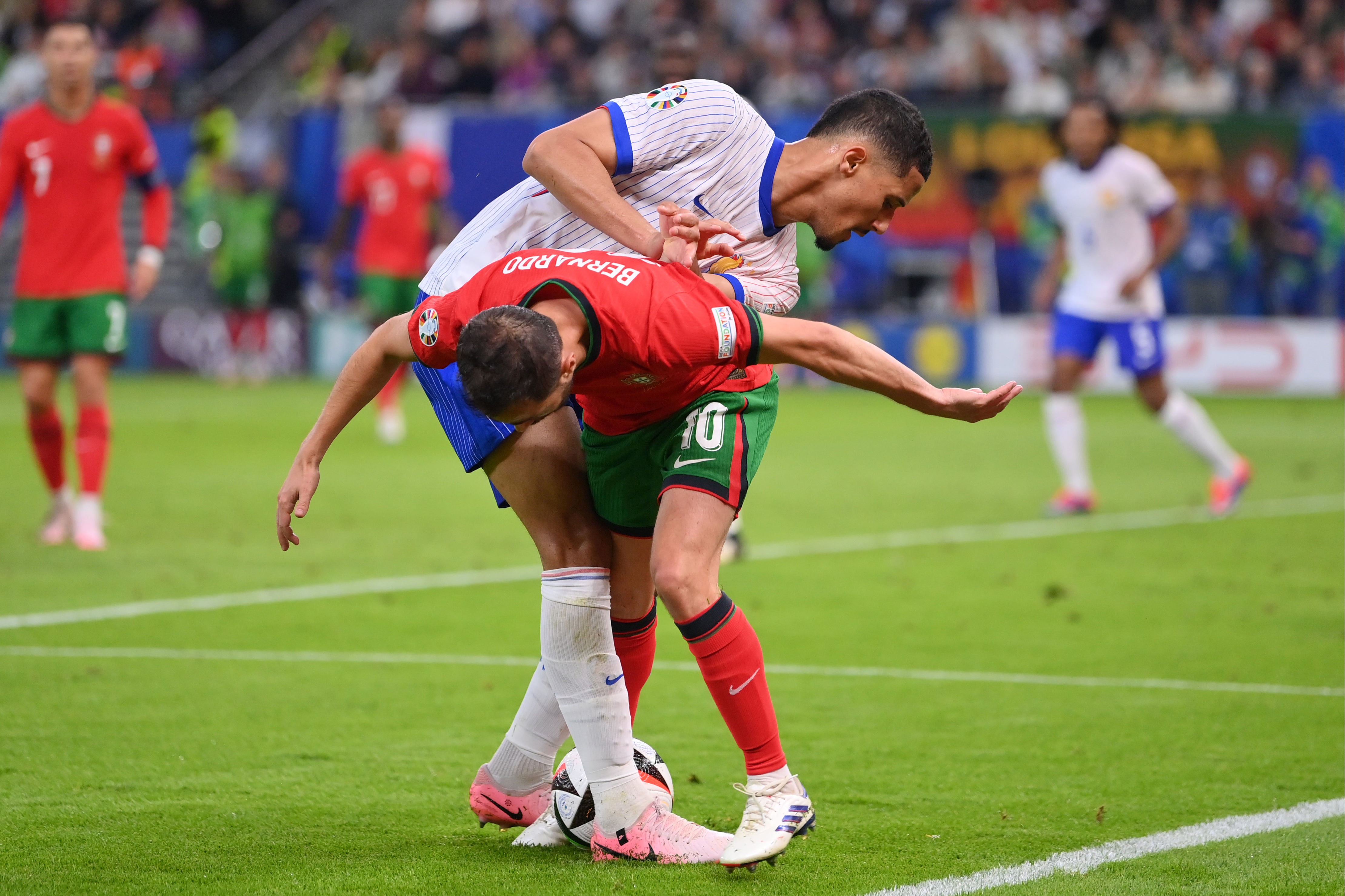 William Saliba and Bernardo Silva battle for the ball