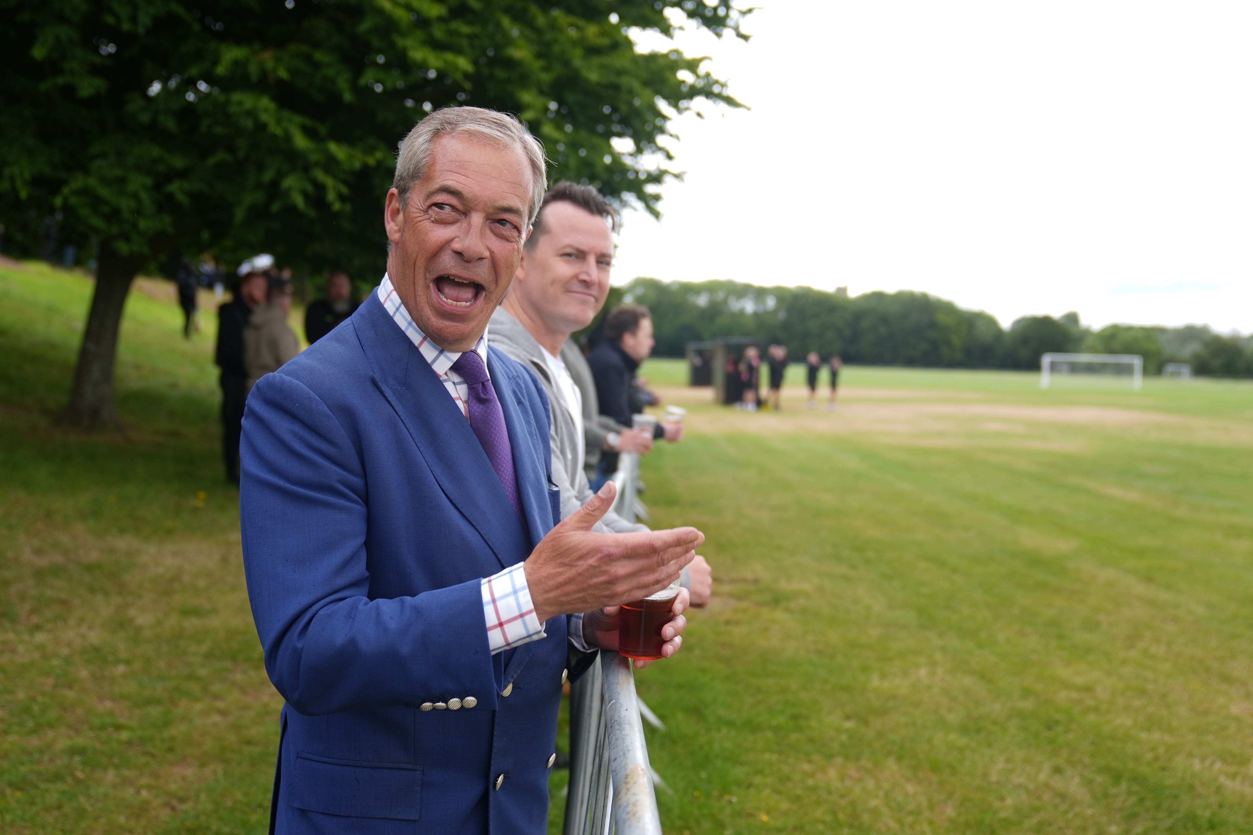 Reform UK leader Nigel Farage and the new Reform MP for South Basildon and East Thurrock, James McMurdock