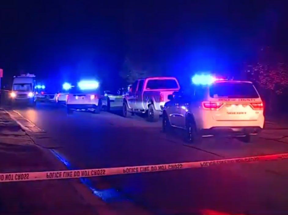 The police presence outside a house in Florence, Kentucky where seven people were shot. Four of the victims died, while three others were taken to hospitals for treatment