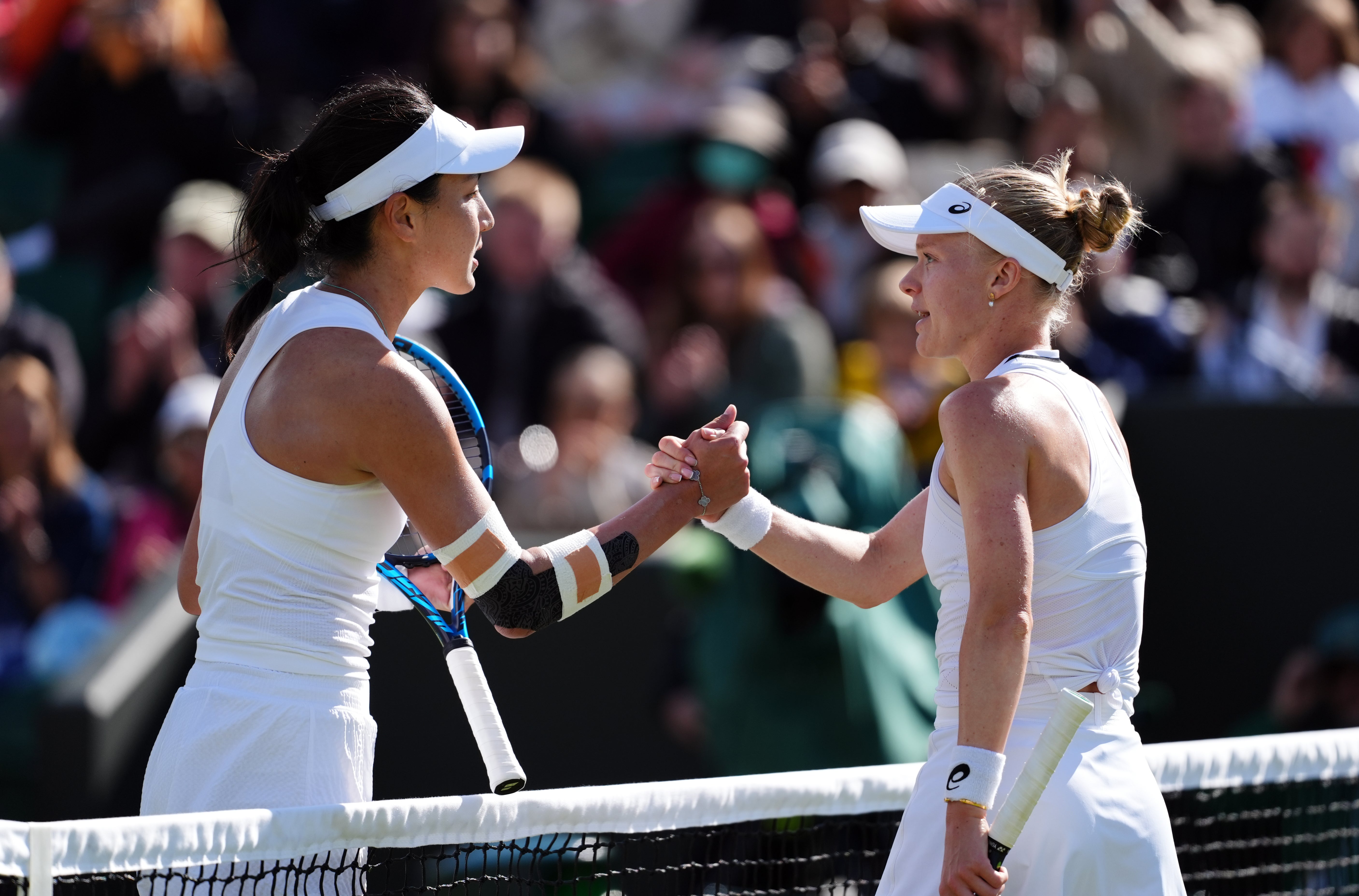 Harriet Dart shakes hands with Wang Xinyu (John Walton/PA)