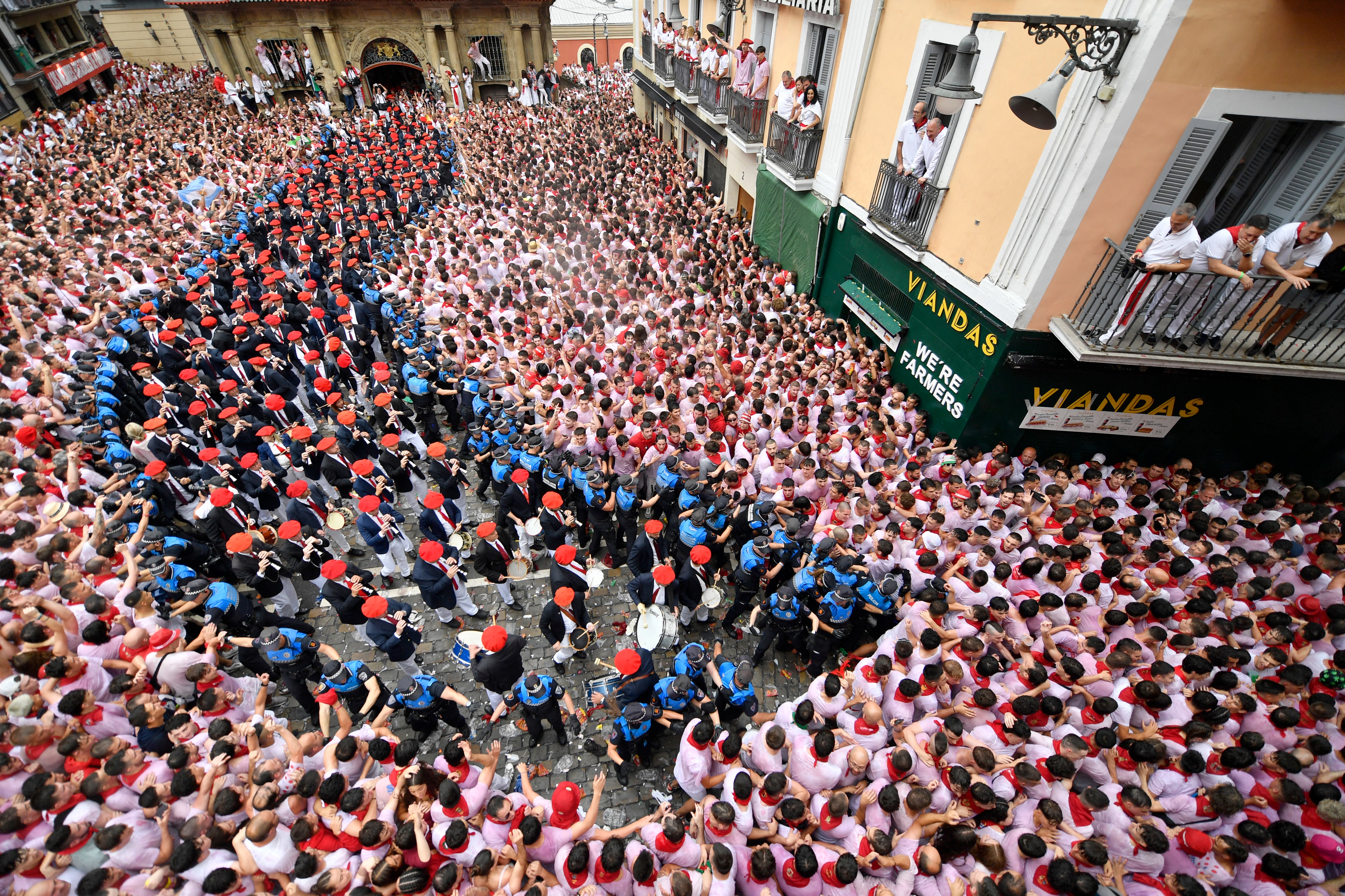 The "Pamplonesa" municipal music band performs during the "Chupinazo" (start rocket) opening ceremony to mark the kick-off of the San Fermin bull Festival outside the Town Hall of Pamplona